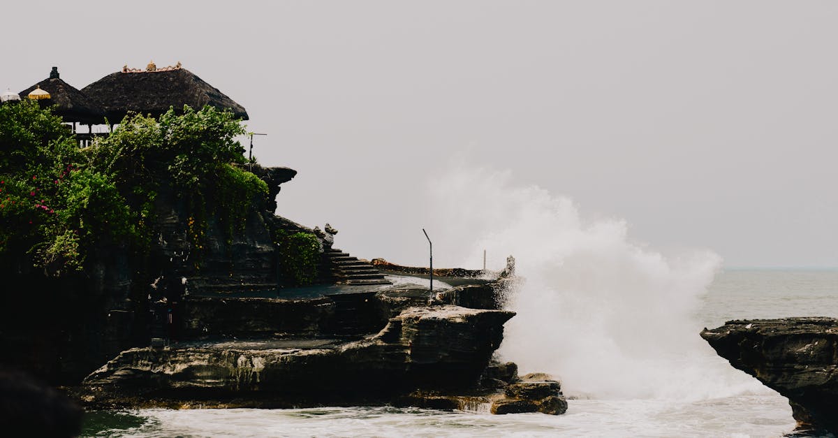 Tanah Lot temple with waves crashing against the rock, Bali, Indonesia