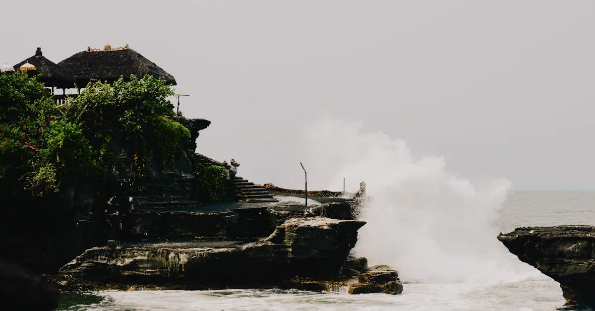 Tanah Lot temple with waves crashing against the rock, Bali, Indonesia
