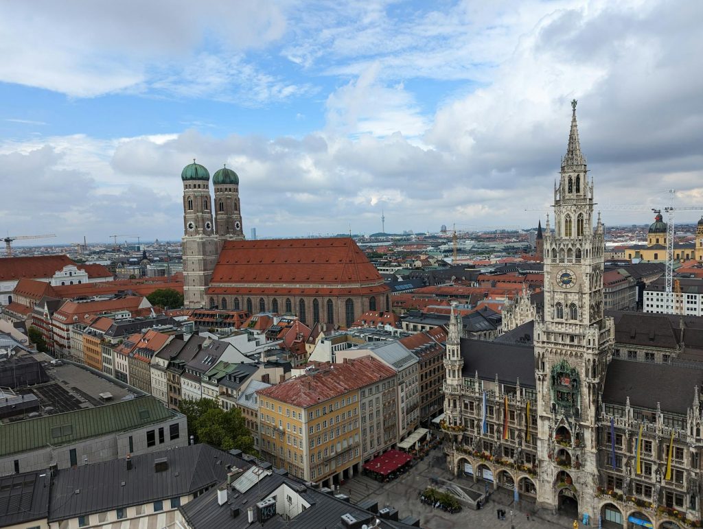 Munich skyline with Frauenkirche towers and the Alps in the background