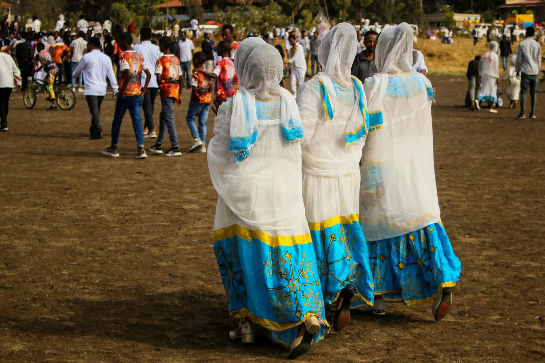 Addis Ababa, Ethiopia — Women in colorful traditional dresses celebrating the Meskel Festival in Addis Ababa, Ethiopia.