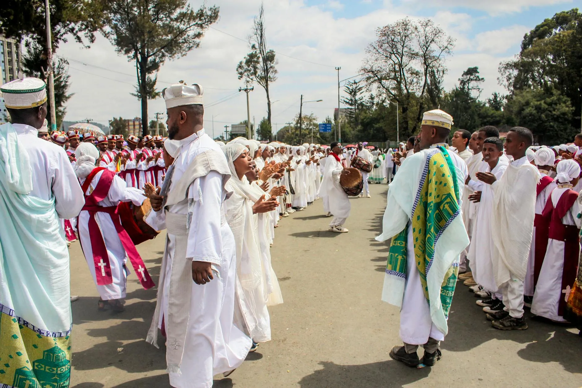 Addis Ababa, Ethiopia — Vibrant Ethiopian Orthodox celebration with traditional attire in Addis Ababa street.