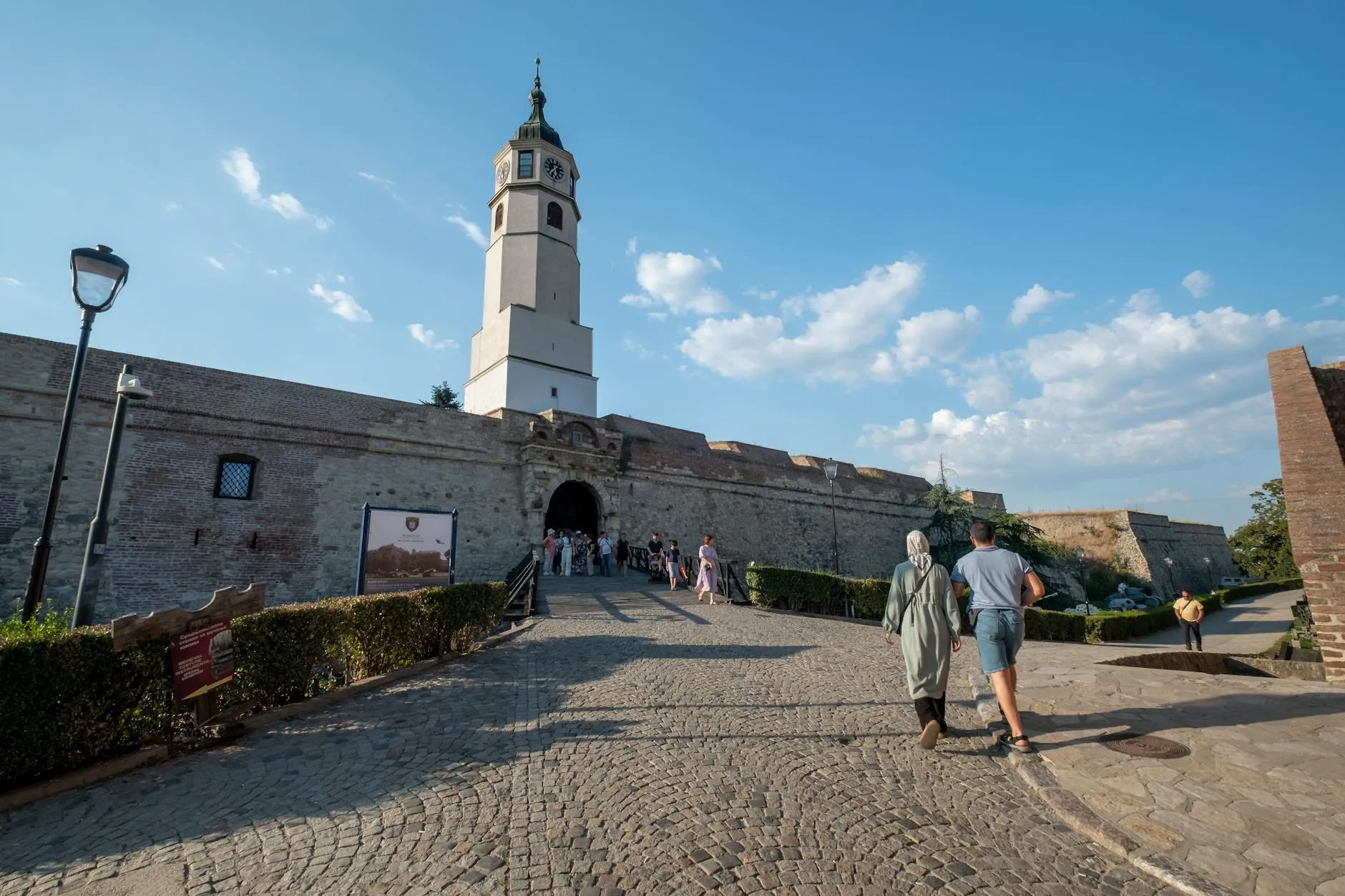 Belgrade Nikola Tesla Airport (BEG) — Visitors strolling through the historic Kalemegdan Fortress in Belgrade, Serbia, under a bright, clear sky.