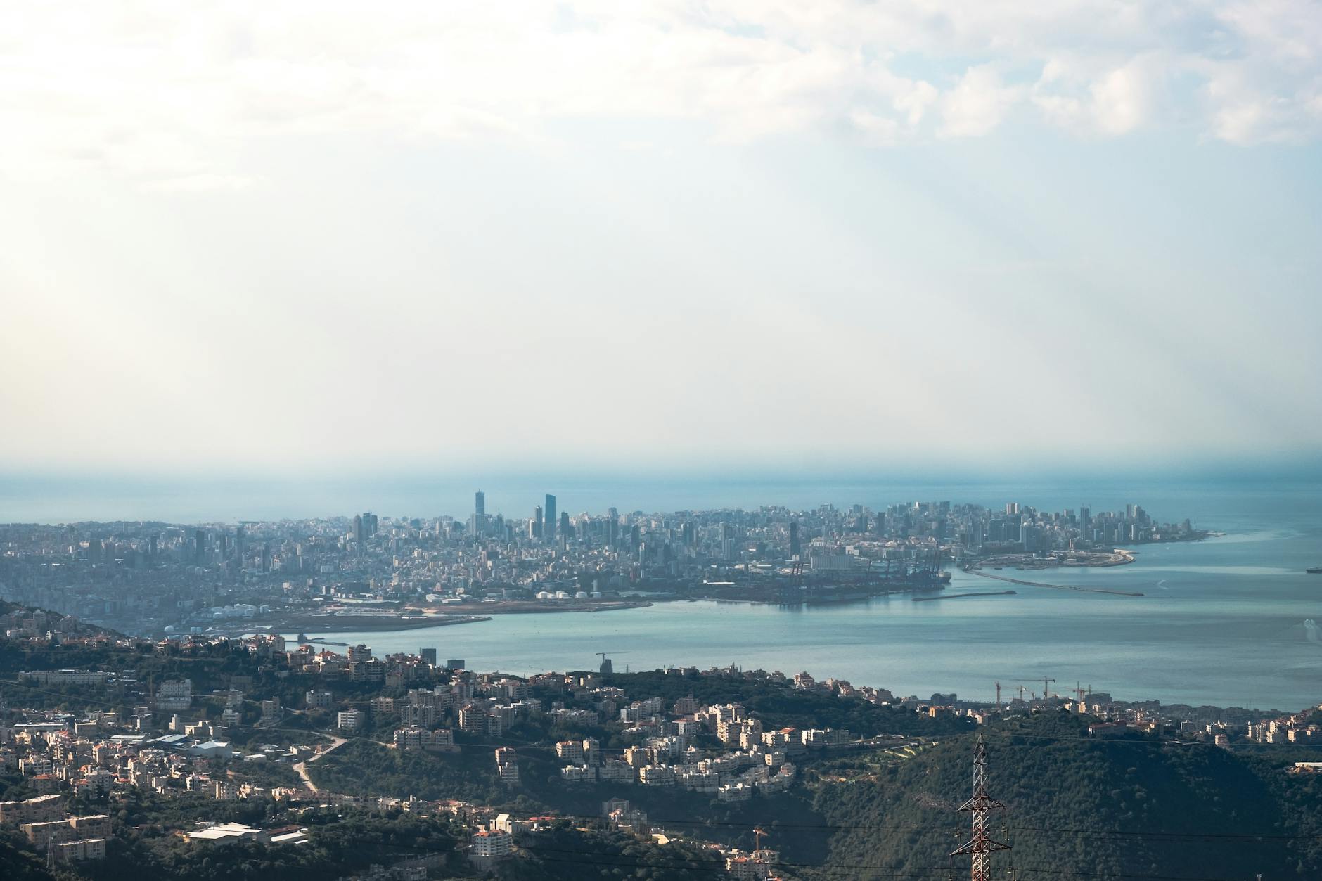 Beirut, Lebanon — Aerial view of Beirut cityscape with harbor and sea under bright daylight, showcasing Lebanon's urban landscape.