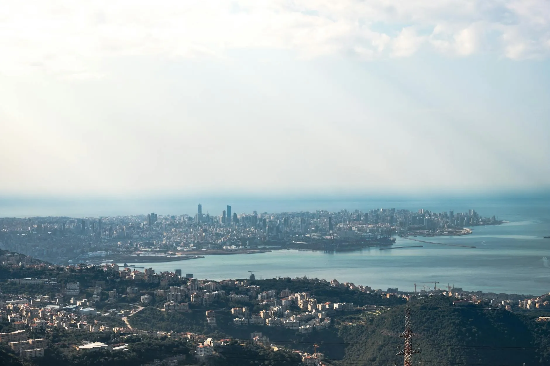 Beirut, Lebanon — Aerial view of Beirut cityscape with harbor and sea under bright daylight, showcasing Lebanon's urban landscape.