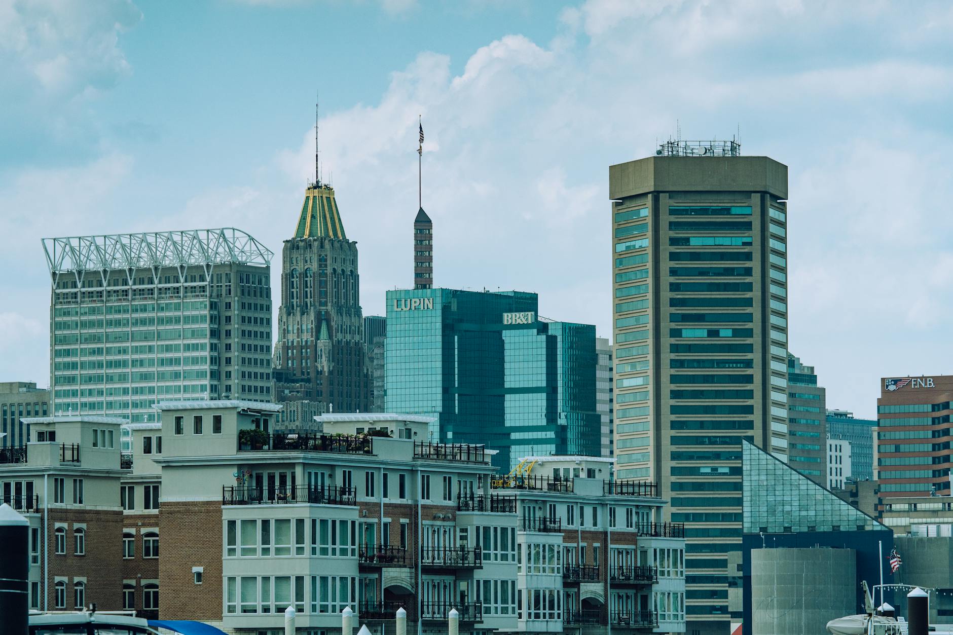 Baltimore-Washington International Thurgood Marshall Airport (BWI) — A vibrant view of Baltimore cityscape featuring iconic skyscrapers under a clear sky.