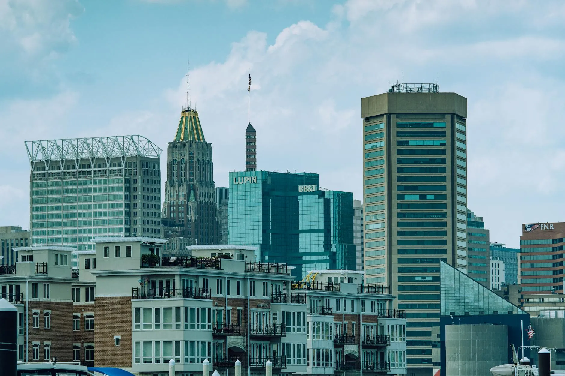 Baltimore-Washington International Thurgood Marshall Airport (BWI) — A vibrant view of Baltimore cityscape featuring iconic skyscrapers under a clear sky.
