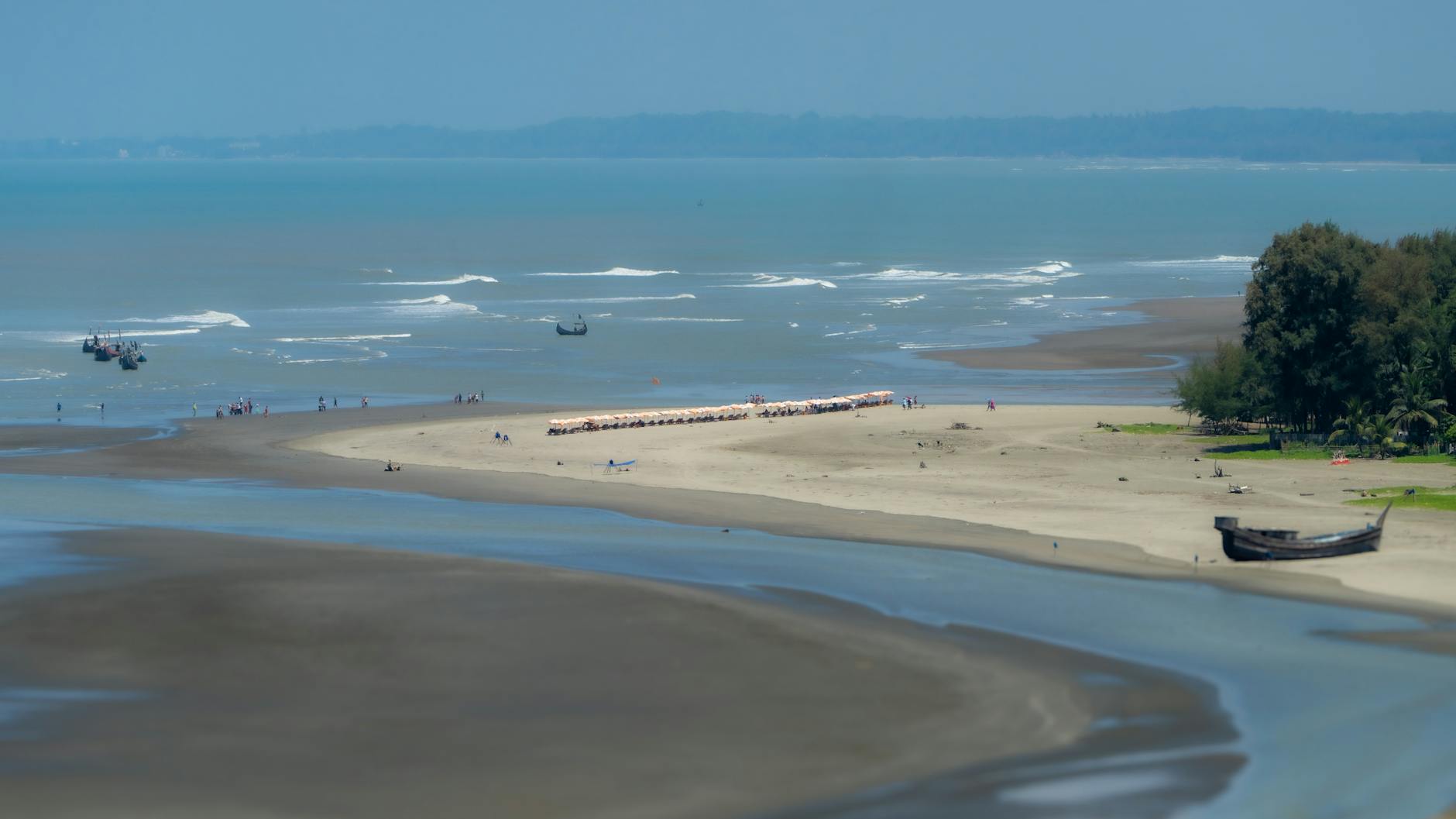 Chattogram, Bangladesh — Aerial view of serene beach, clear blue water at Cox's Bazar, Bangladesh.
