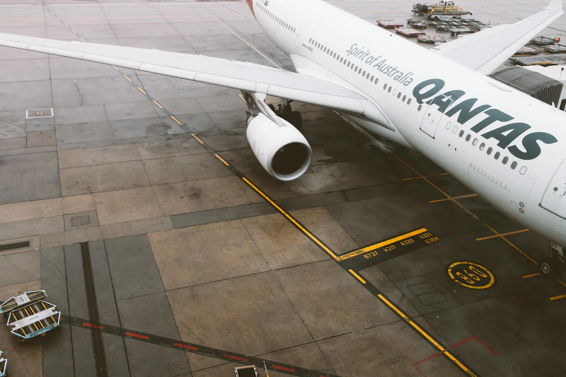 Qantas commercial airplane parked on the tarmac at Melbourne Airport, Australia.