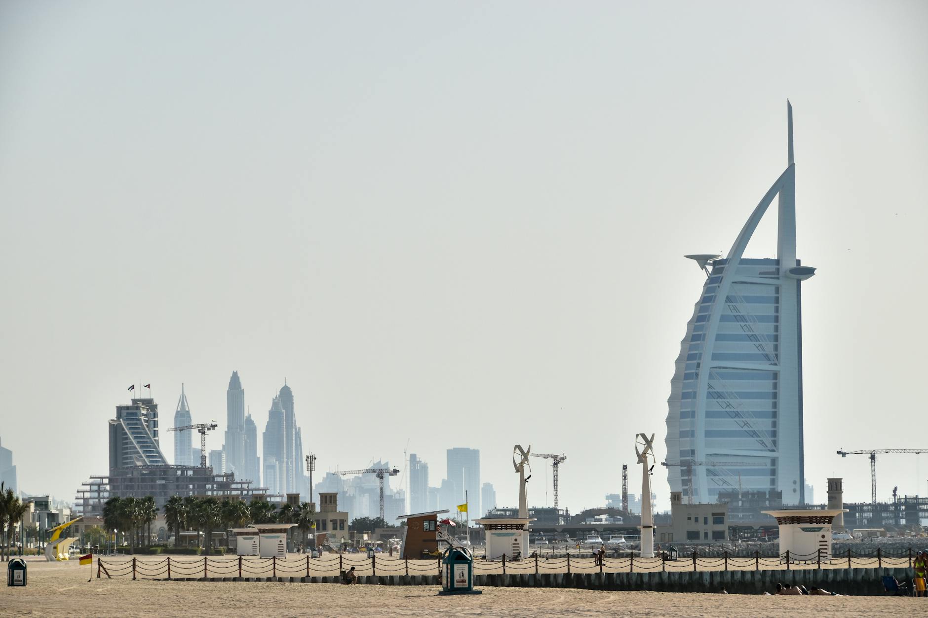 The iconic Burj Al Arab against the backdrop of Dubai's magnificent skyline, showcasing modern architecture.