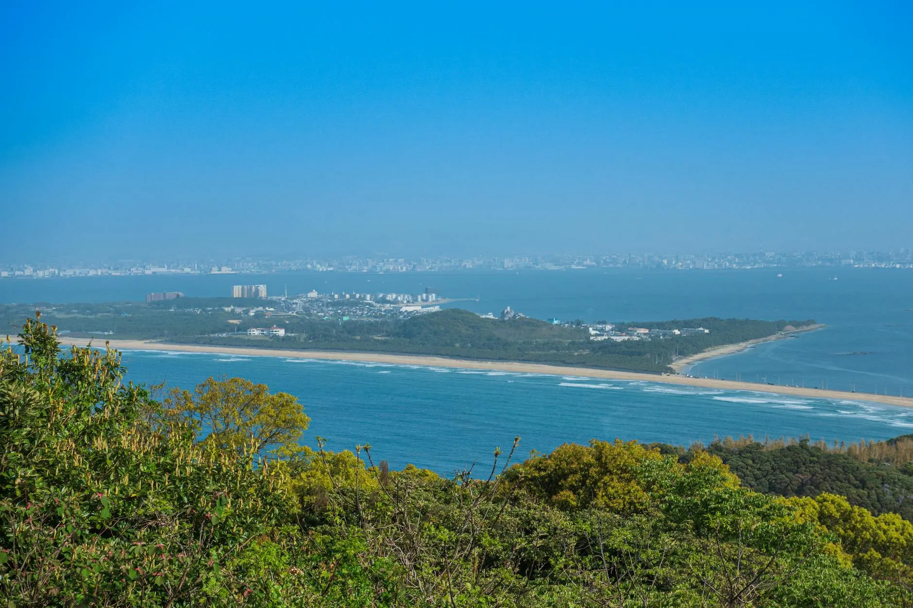 Fukuoka, Japan — Breathtaking Fukuoka skyline with coastal view and lush greenery, showcasing Japan's natural beauty.