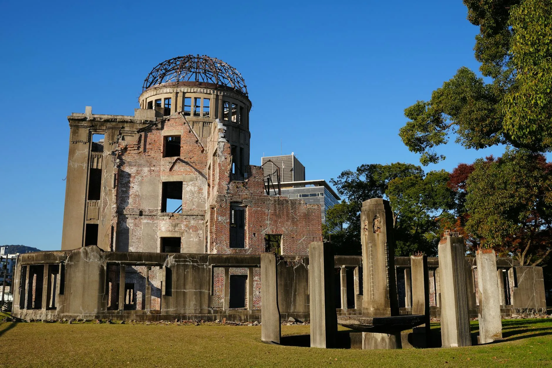 Hiroshima, Japan — Explore the iconic Hiroshima Peace Memorial Dome under bright blue skies, symbolizing peace and history.