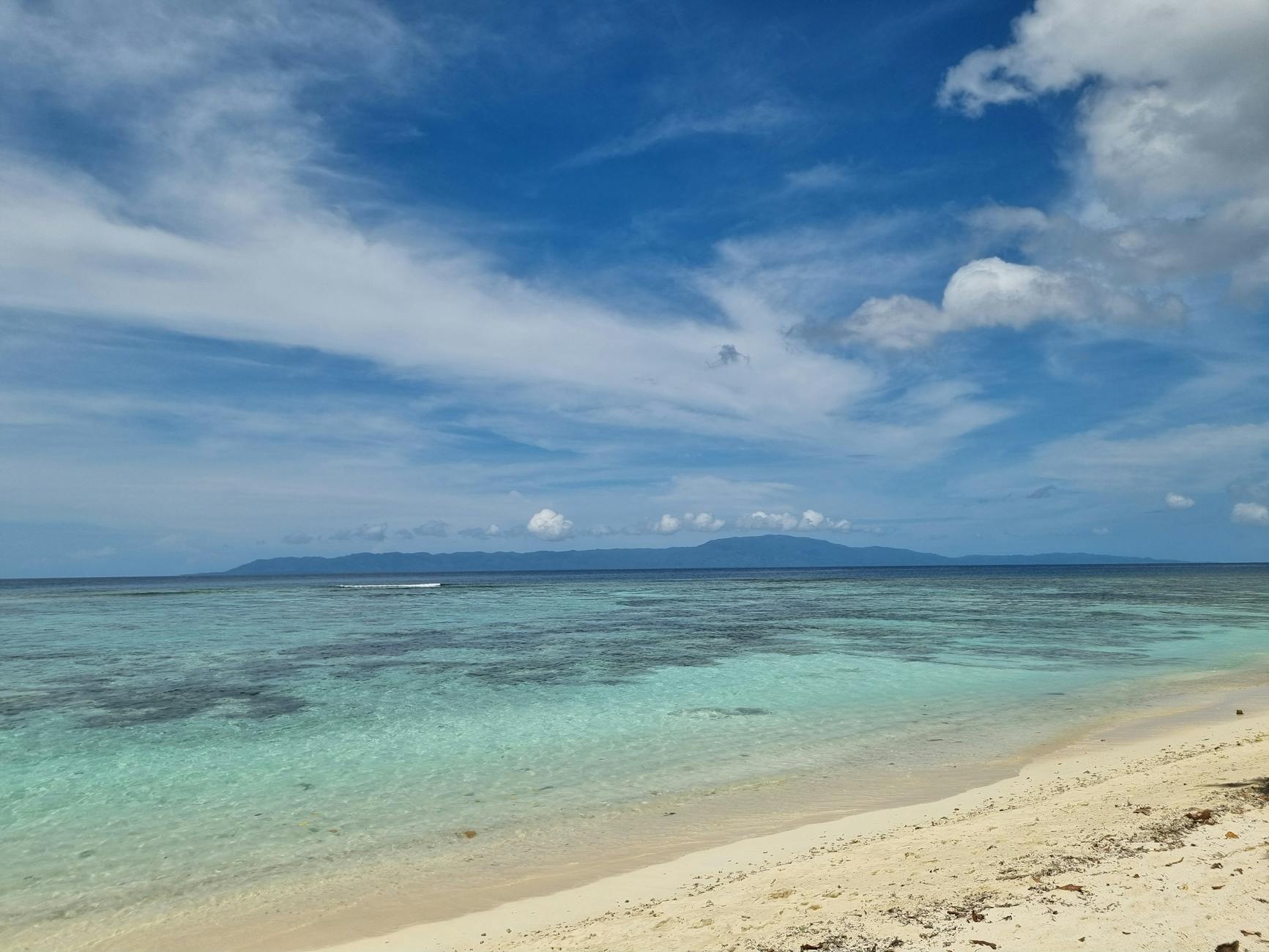 Honiara, Solomon Islands — Explore the tranquil beach of Gizo, Solomon Islands with clear waters and sandy shores.
