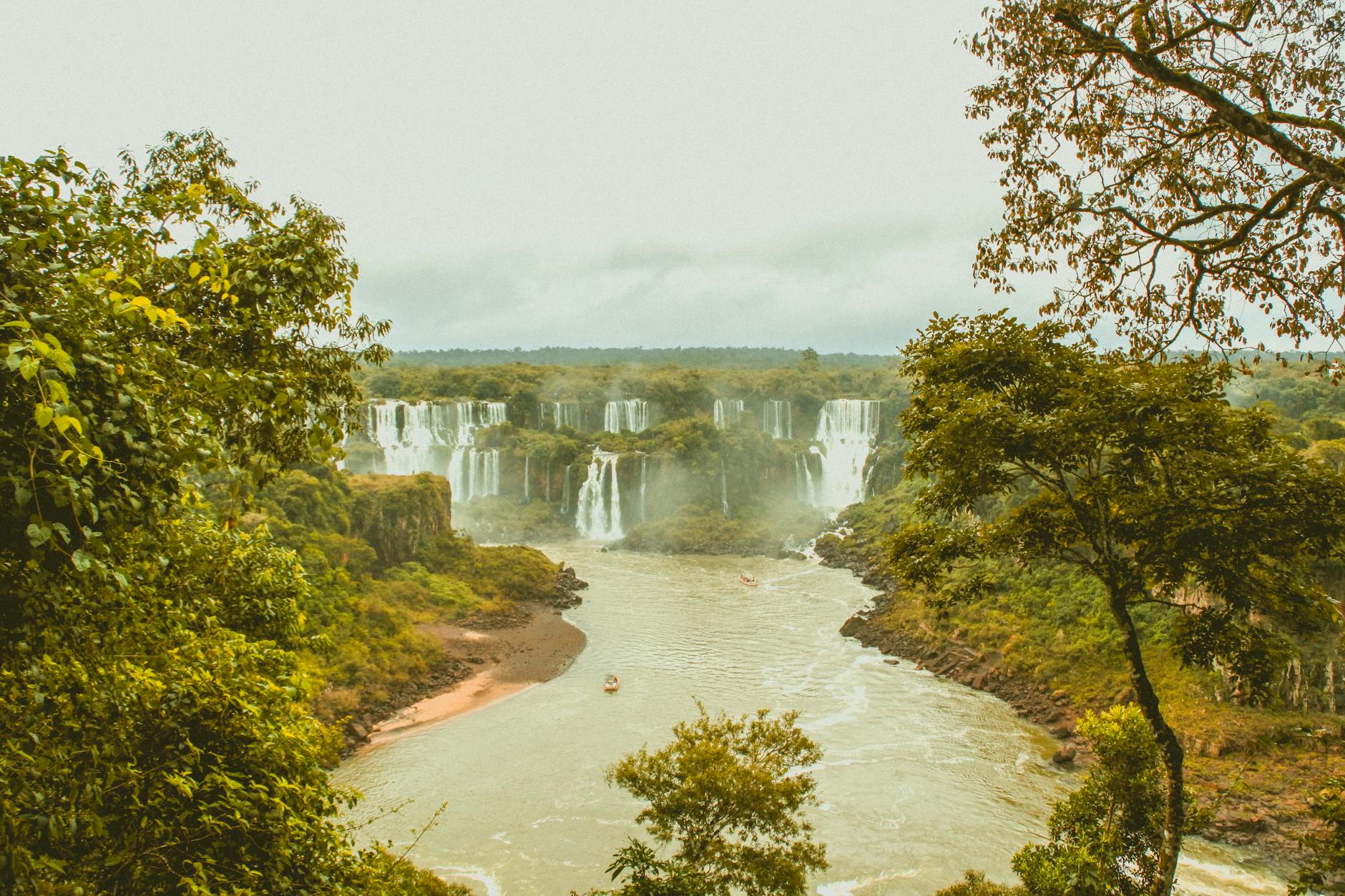 Foz do Iguaçu, Brazil — Breathtaking aerial view of Iguazu Falls surrounded by lush rainforest in Foz do Iguaçu, Brazil.