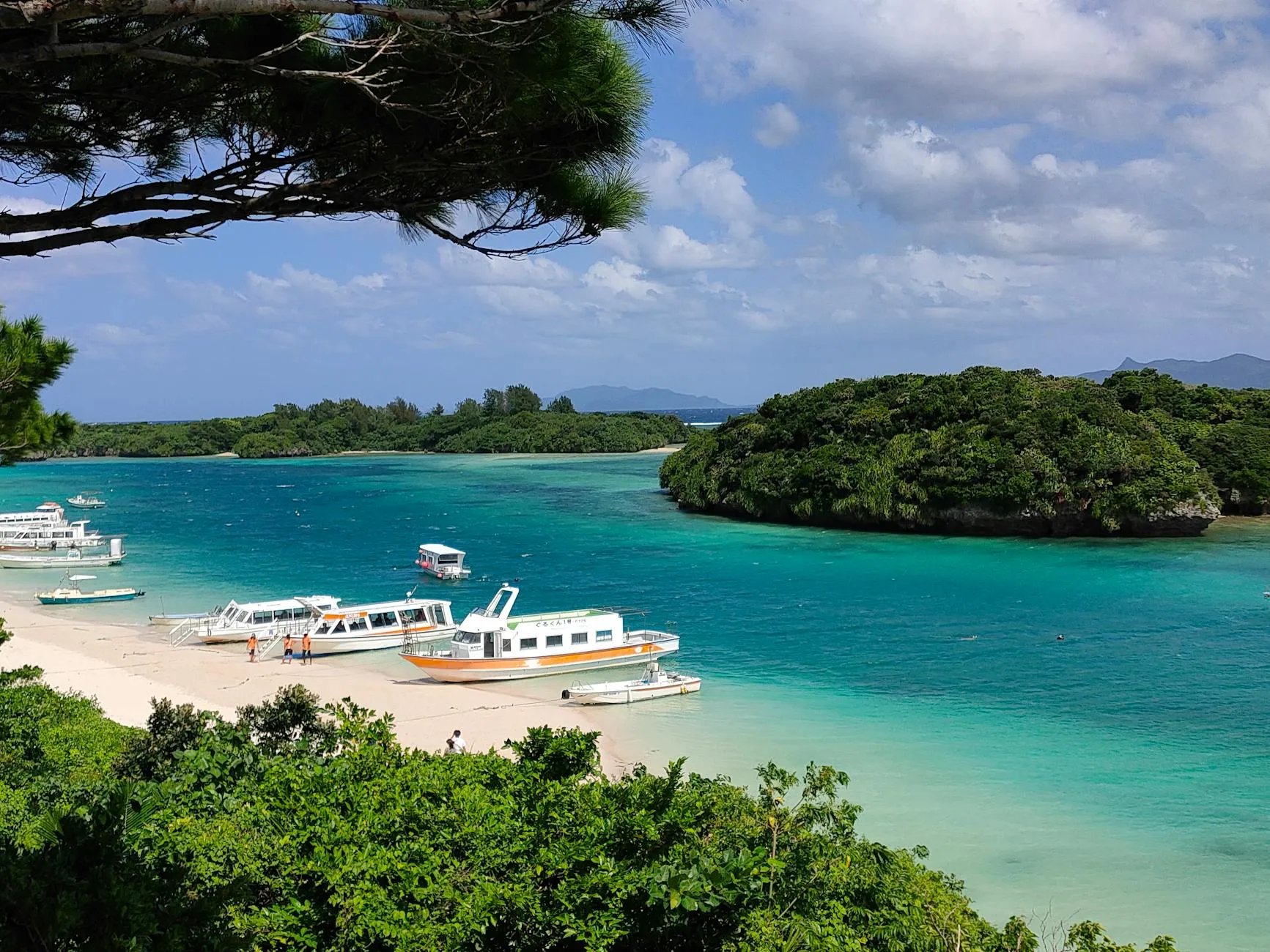 Ishigaki, Okinawa, Japan — Explore the stunning beaches and turquoise waters of Ishigaki, Okinawa with scenic boat views.