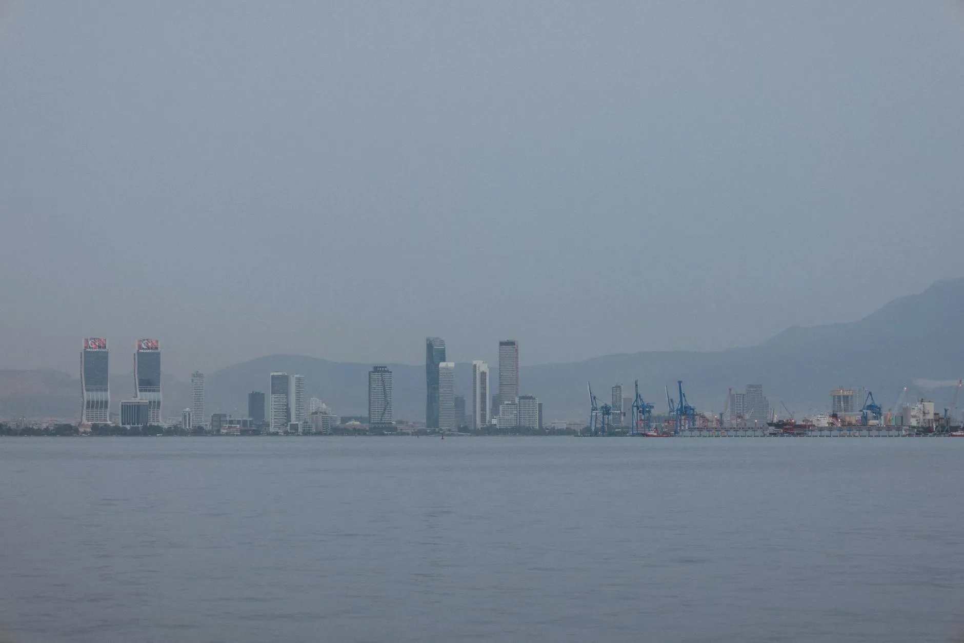 Cityscape of Izmir showcasing waterfront skyline with modern skyscrapers.