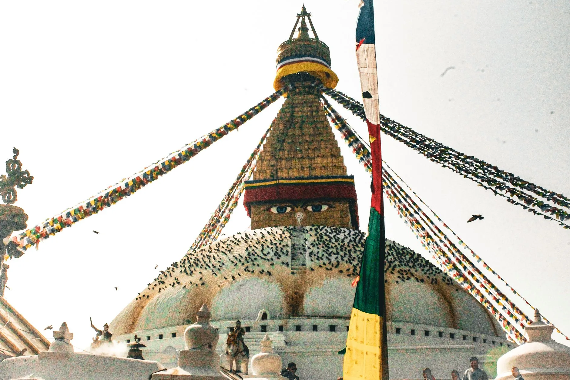 Kathmandu Nepal — Boudhanath Stupa with colorful prayer flags under clear sky in Kathmandu, Nepal.