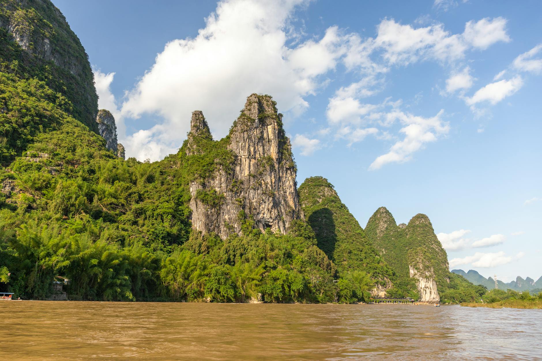 Guilin, China — Explore the iconic karst mountains and serene Li River landscape in Guilin, China.