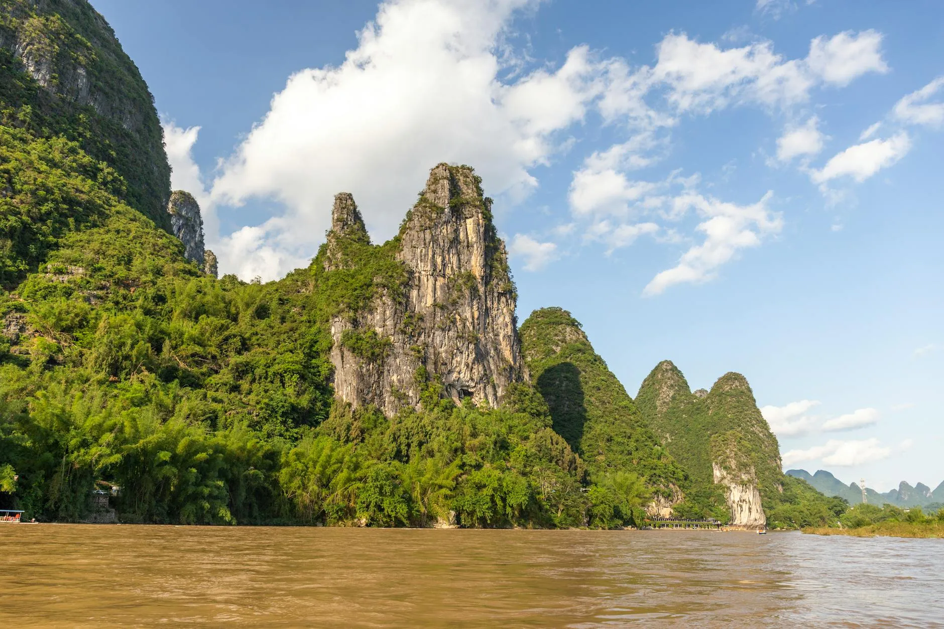 Guilin, China — Explore the iconic karst mountains and serene Li River landscape in Guilin, China.