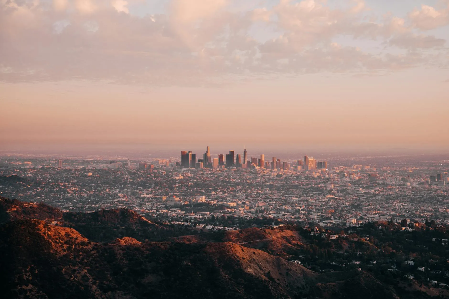 Los Angeles, California — Aerial view of Los Angeles skyline during sunset with hills in the foreground.