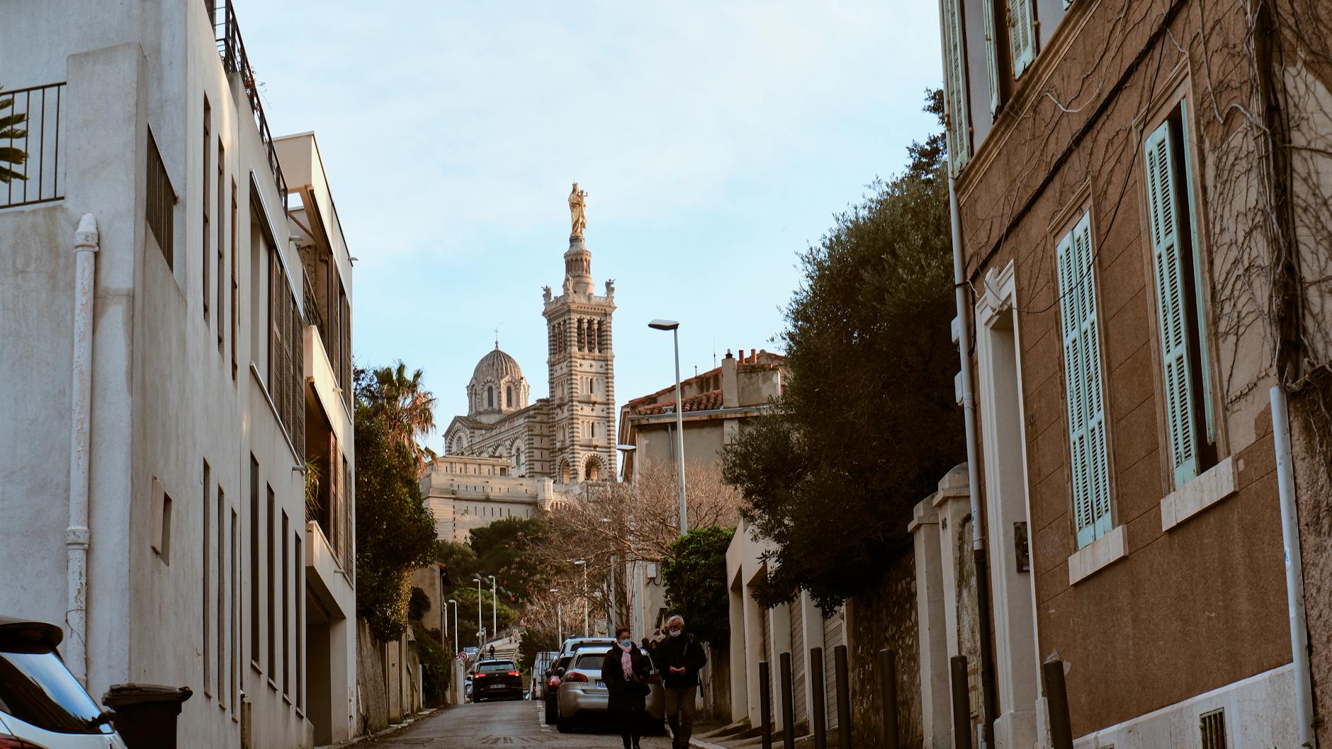 Marseille Provence Airport (MRS) — Captivating street scene with Notre-Dame de la Garde in Marseille, France, showcasing historical architecture.