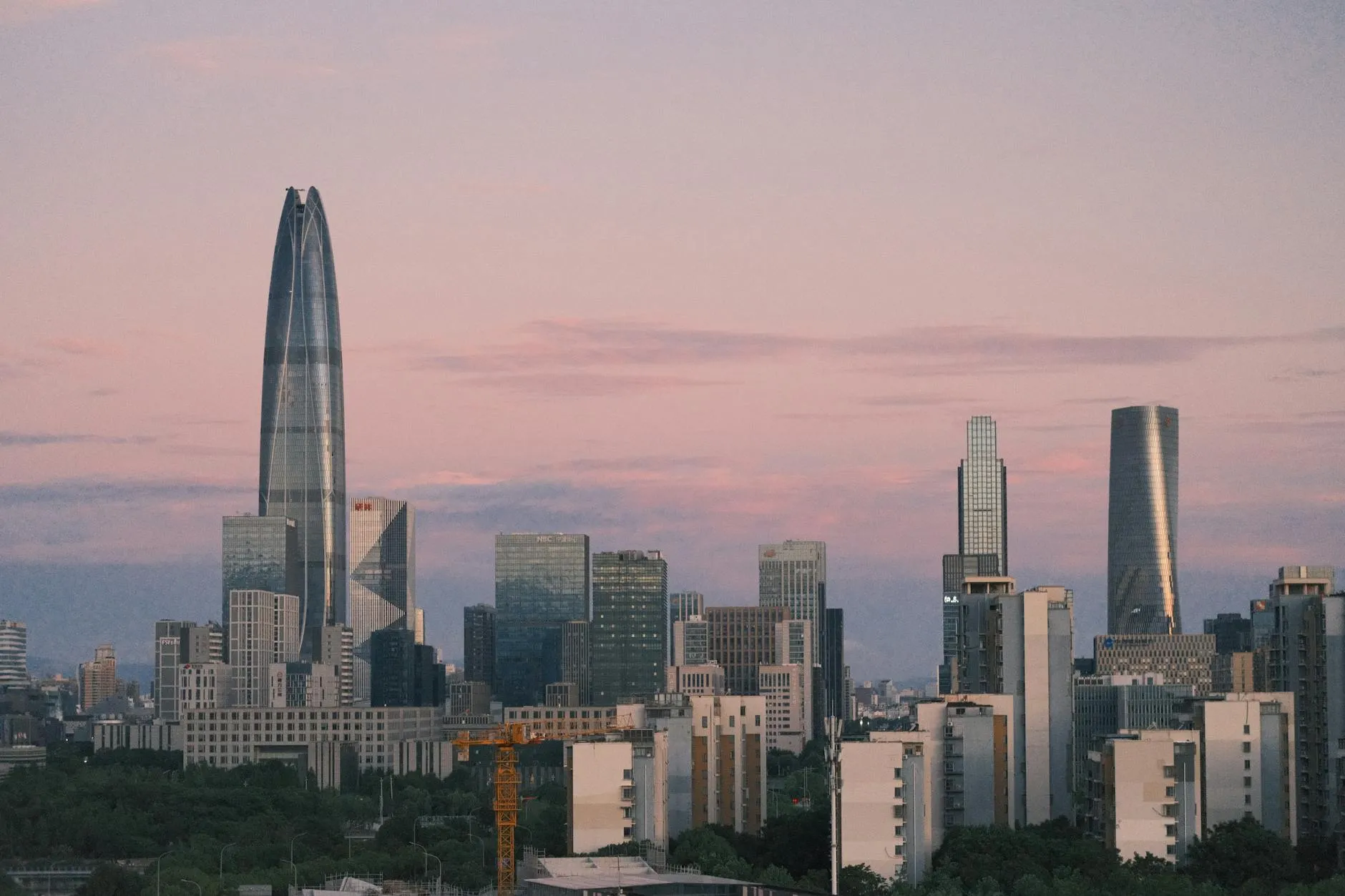 Ningbo Zhejiang China — Capture of Ningbo's skyline at twilight featuring contemporary skyscrapers under a pastel sky.