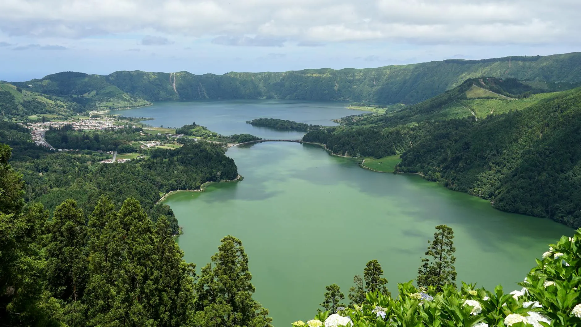 Azores Portugal — A breathtaking aerial view of the Sete Cidades crater lakes with lush greenery in the Azores, Portugal.