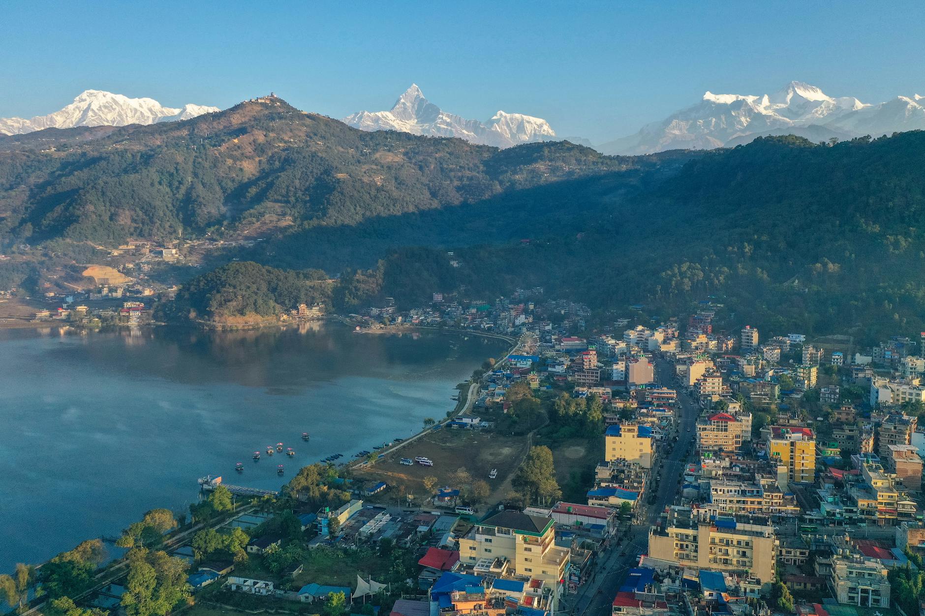 Pokhara, Nepal — Stunning aerial view of Pokhara, Nepal with Phewa Lake and Annapurna Range under a clear blue sky.