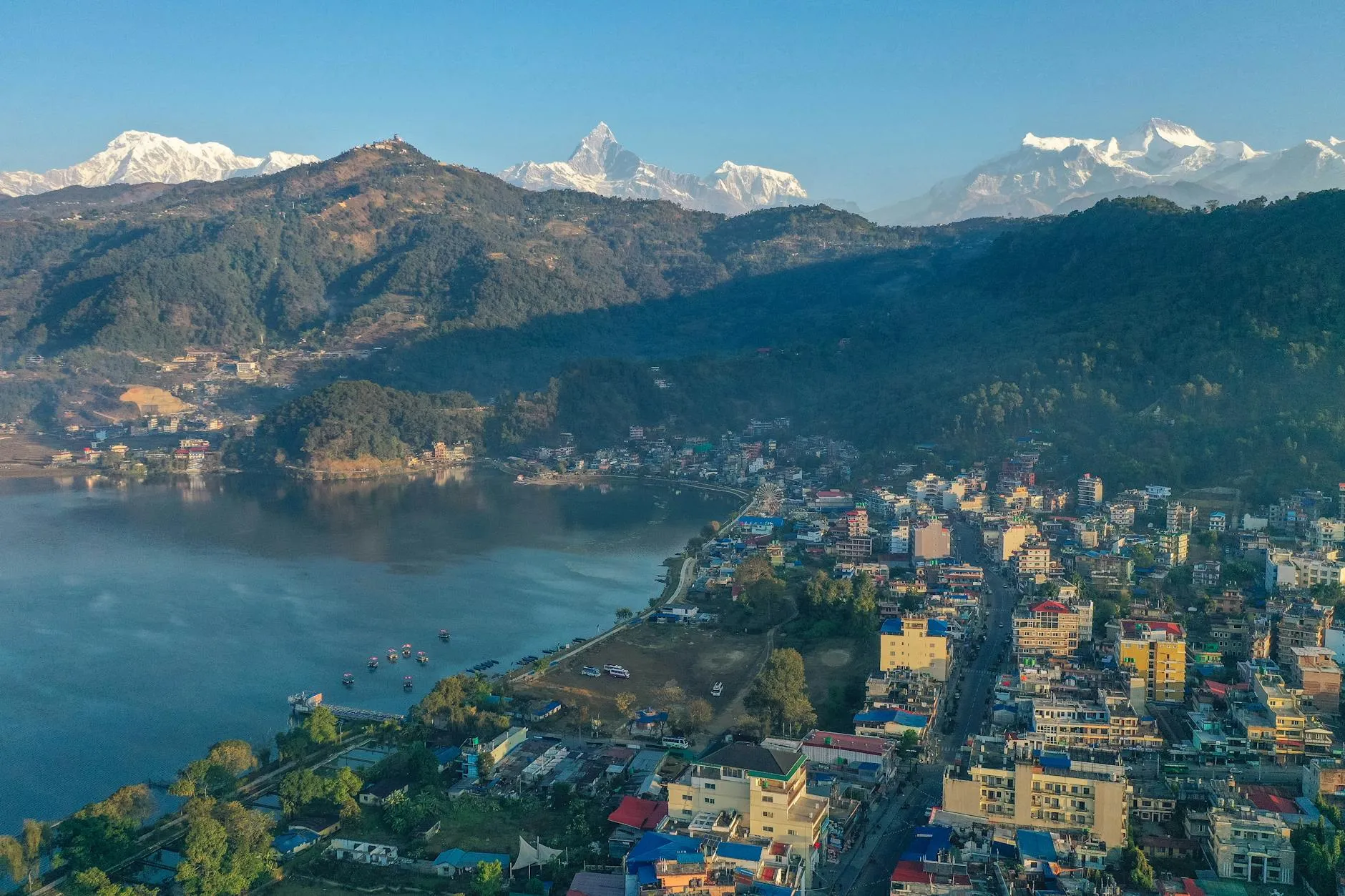 Pokhara, Nepal — Stunning aerial view of Pokhara, Nepal with Phewa Lake and Annapurna Range under a clear blue sky.