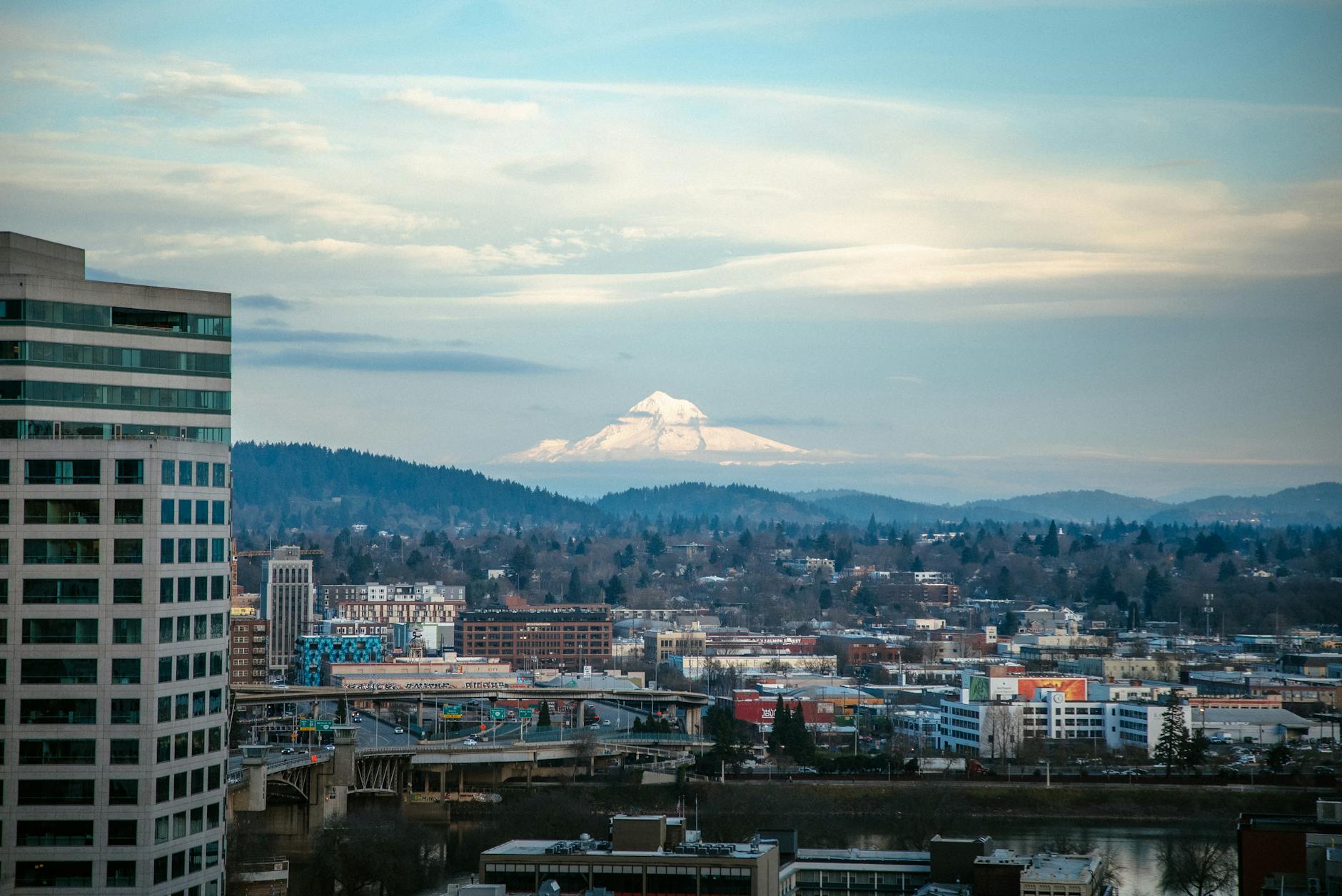 Stunning urban and mountain view of Portland with Mount Hood in the distance.