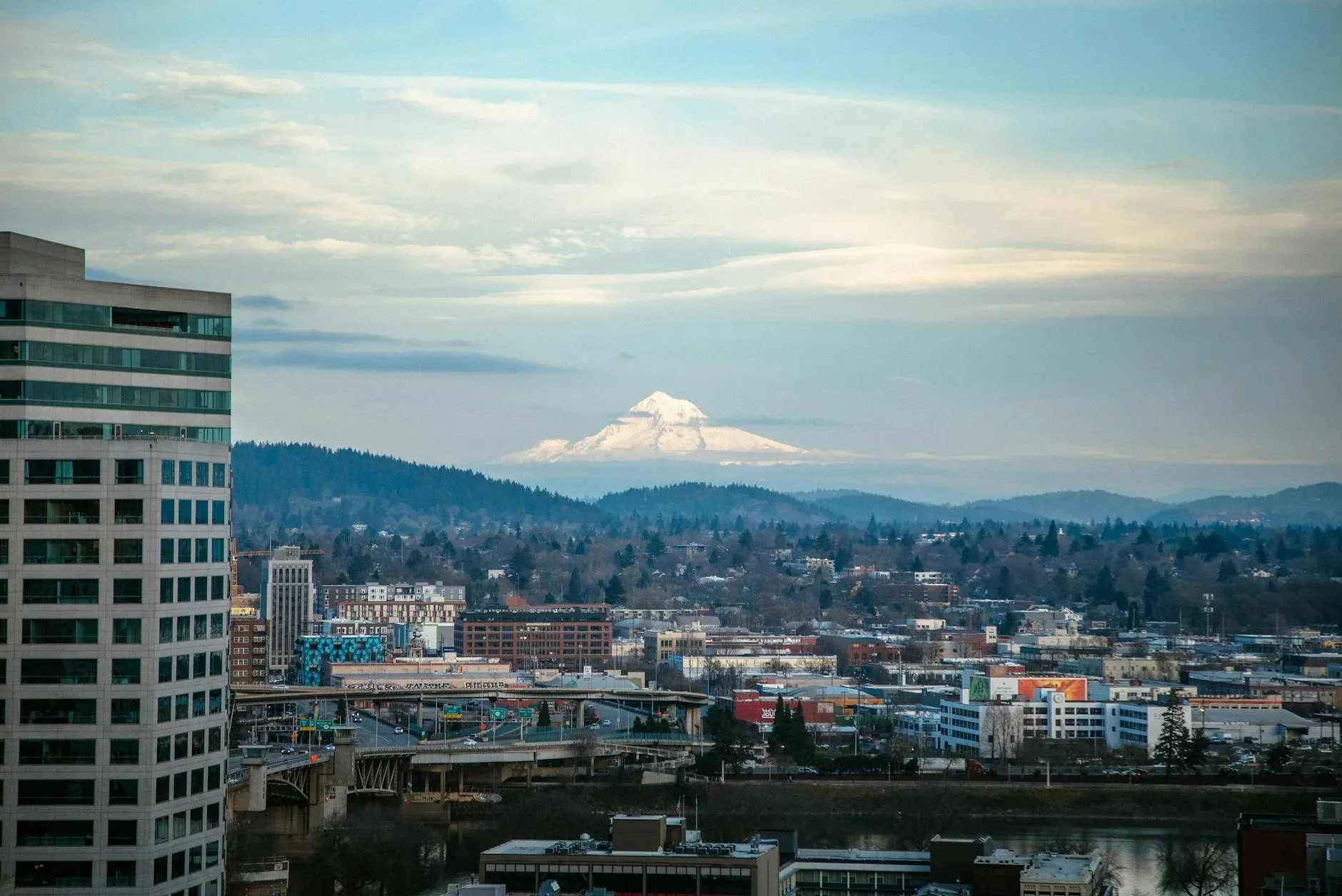 Stunning urban and mountain view of Portland with Mount Hood in the distance.