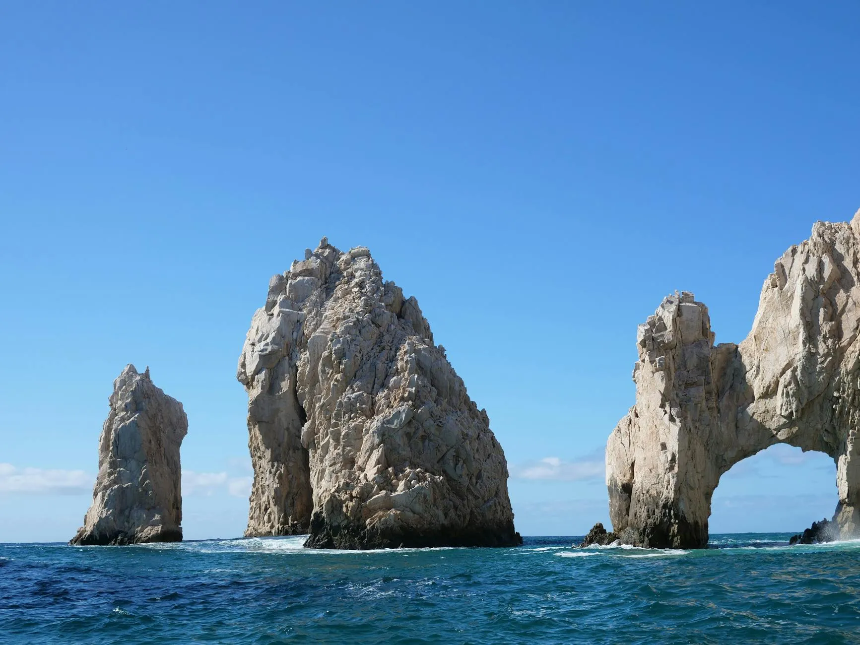 Los Cabos Mexico — A breathtaking capture of El Arco rock formations in Cabo San Lucas against a clear sky.