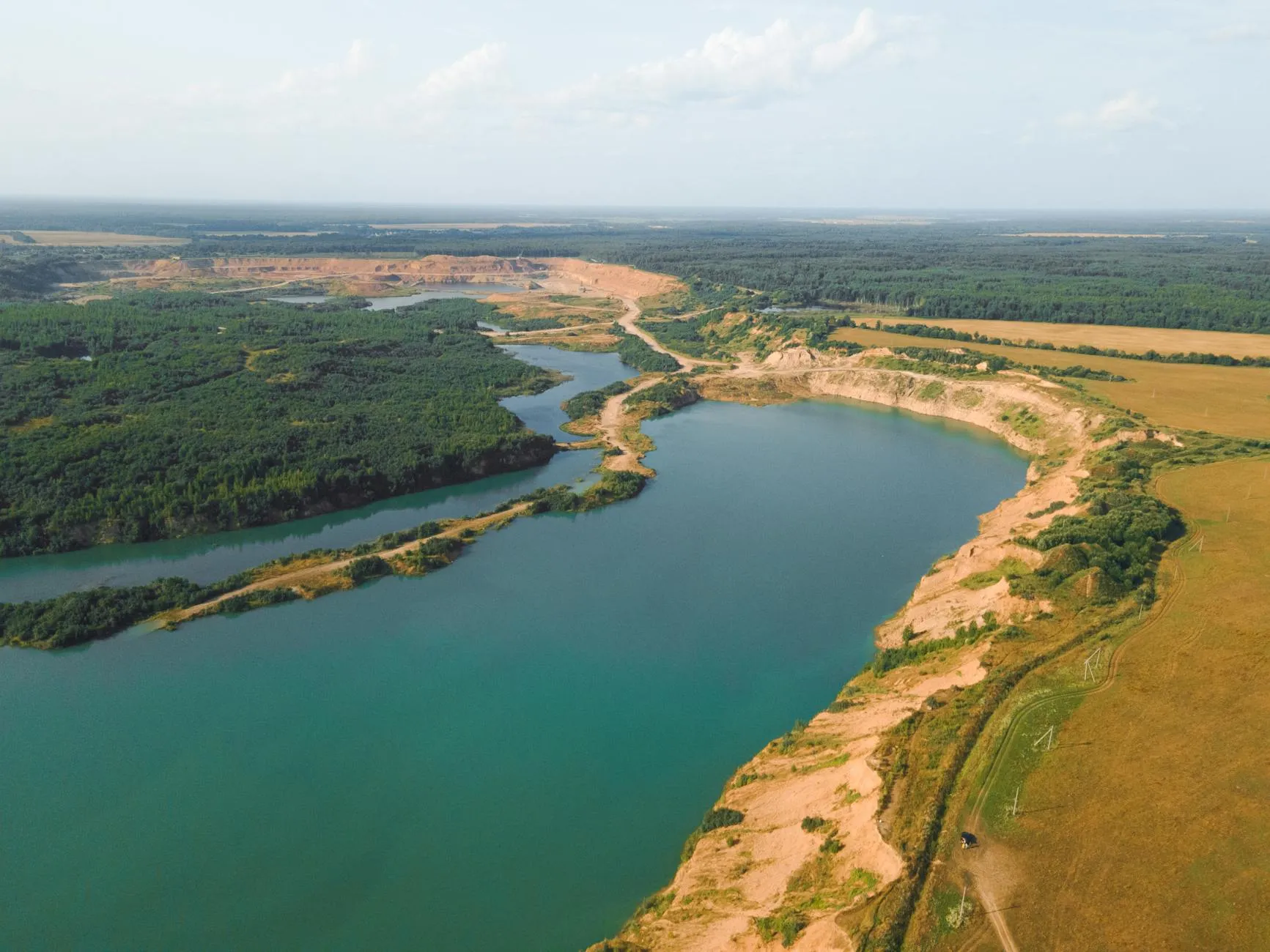 Uralsk Kazakhstan — A breathtaking drone shot of Kazakhstan's rural landscape with river and fields.