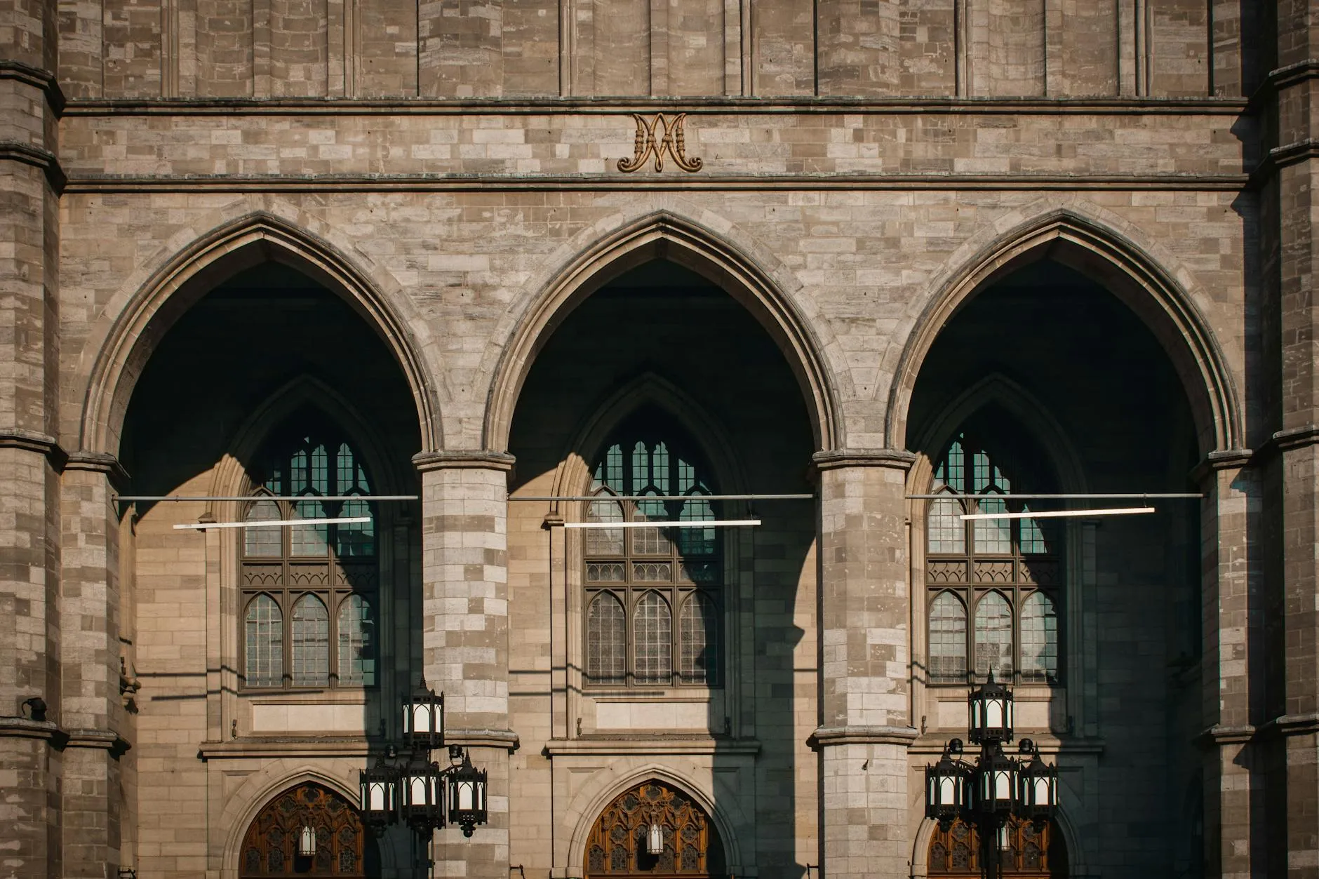 Montréal-Trudeau Airport (YUL) — Facade of the Gothic Revival Notre-Dame Basilica in Montreal, showcasing elegant arches and intricate design.