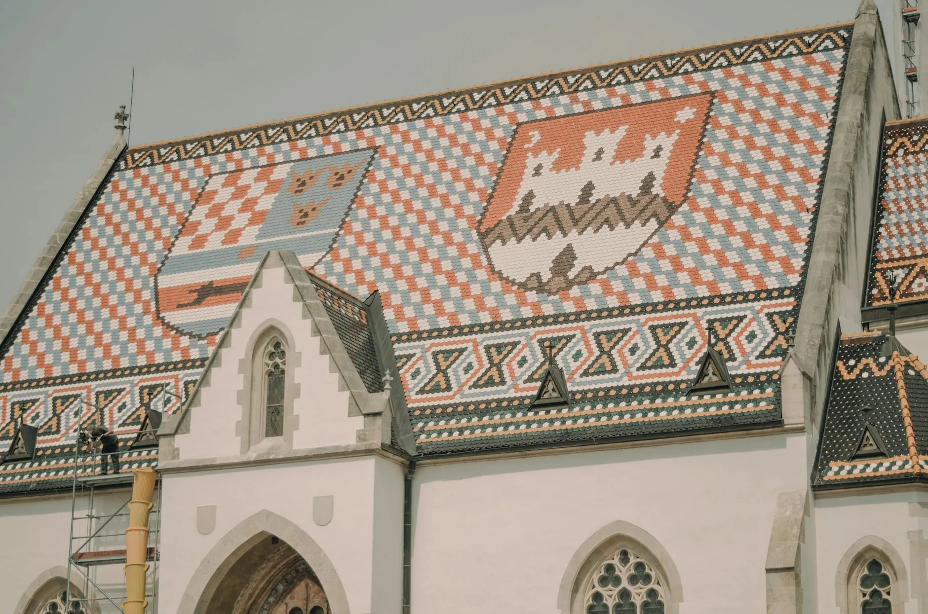 Zagreb Airport (ZAG) — Intricate roof tiles on St. Mark's Church in Zagreb, showcasing distinctive medieval patterns.