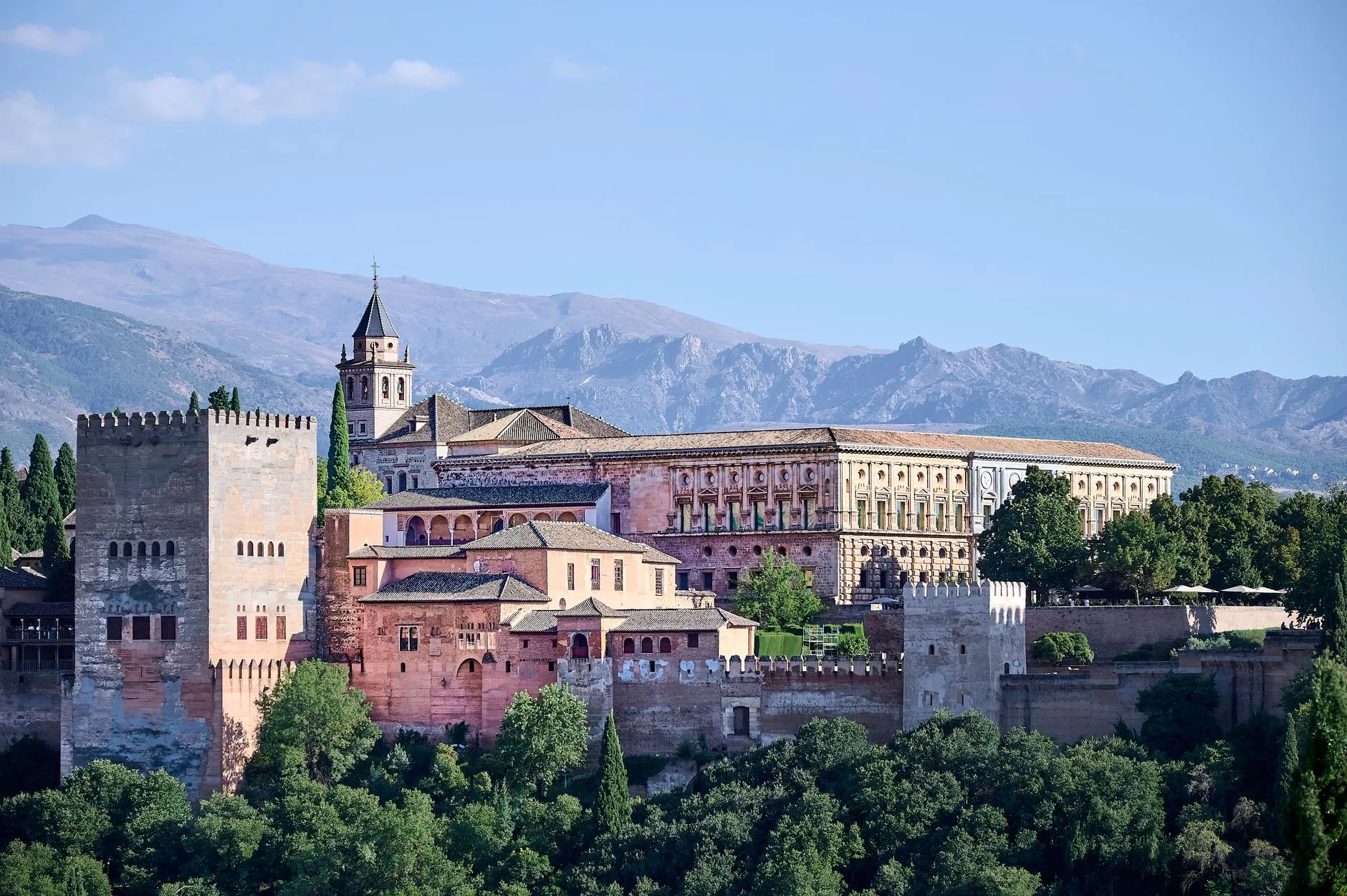 Andalusia — Stunning view of the Alhambra and Sierra Nevada mountains in Granada, Spain, showcasing iconic Andalusian architecture.