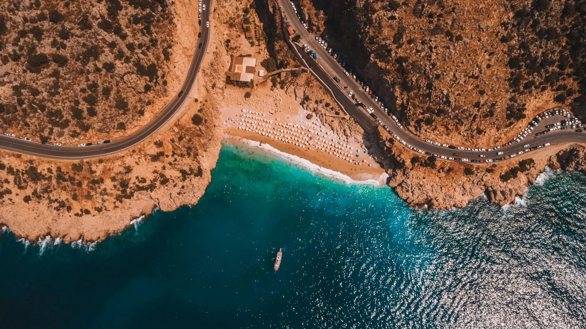 The Turkish Riviera — Stunning aerial view of Kaputaş Beach on the Antalya coastline, featuring turquoise waters and rocky cliffs.