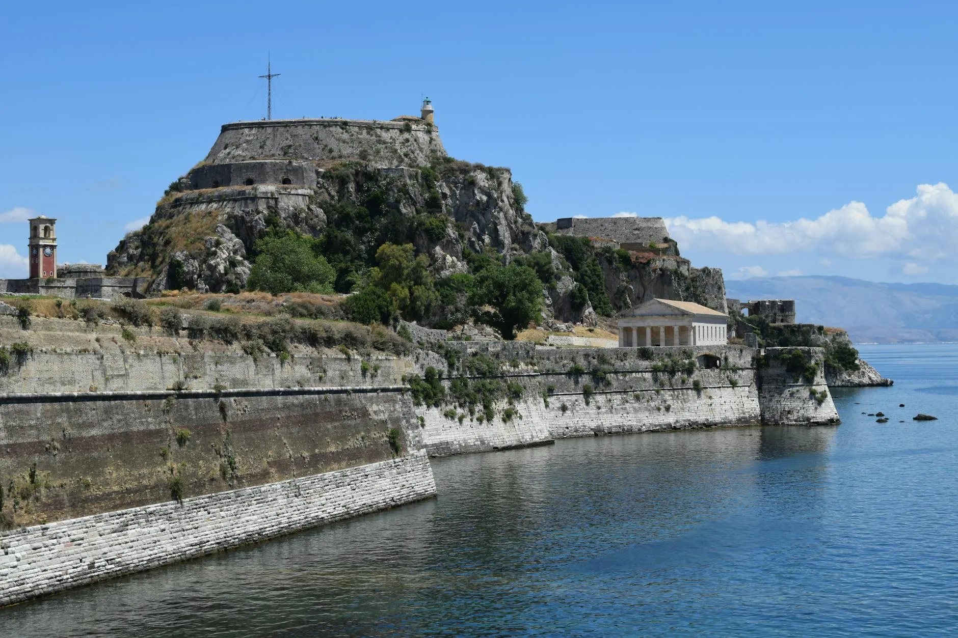 Corfu, Greece — Historic Old Fortress of Corfu overlooking the Ionian Sea under a clear blue sky.