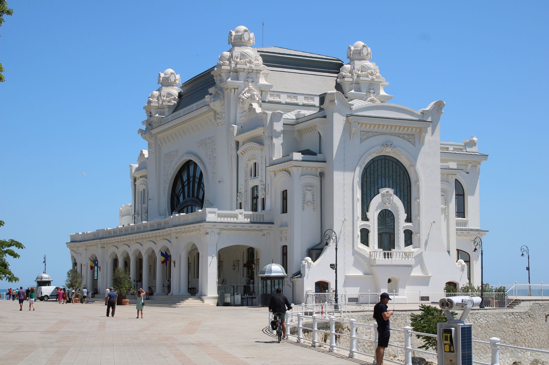 Constanța, Romania — A stunning view of the historic Constanța Casino in Romania by the Black Sea under a clear blue sky.