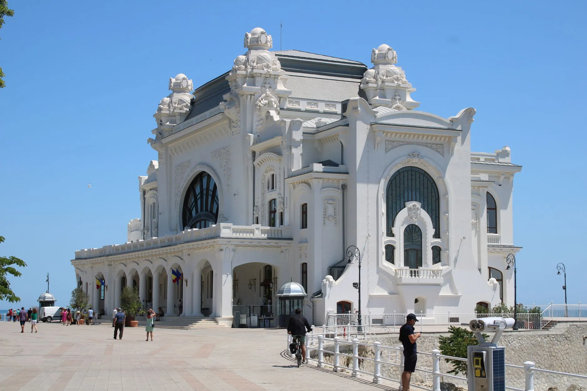 Constanța, Romania — A stunning view of the historic Constanța Casino in Romania by the Black Sea under a clear blue sky.