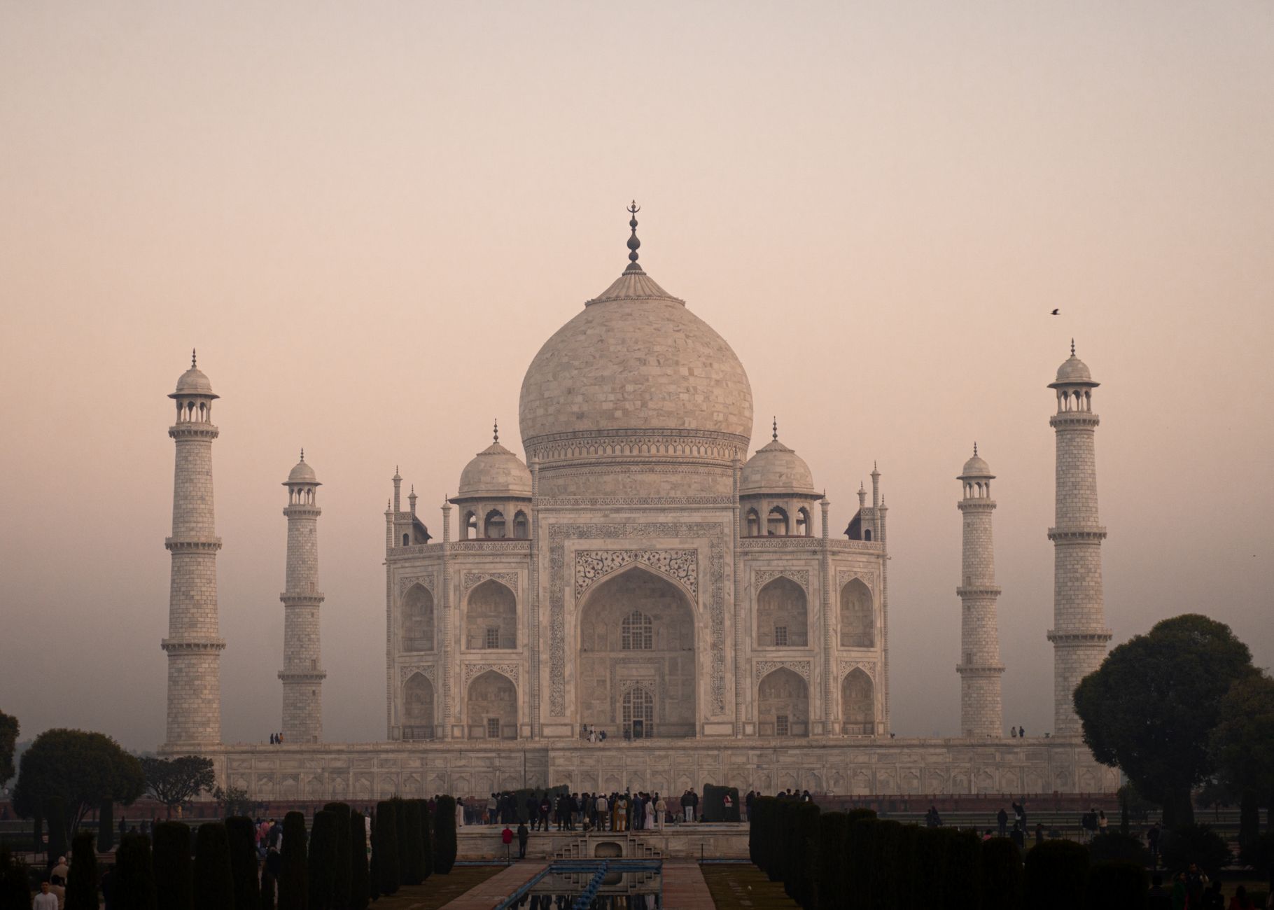 India — The iconic Taj Mahal in Agra, India at sunrise, showcasing its majestic white marble and architectural beauty.