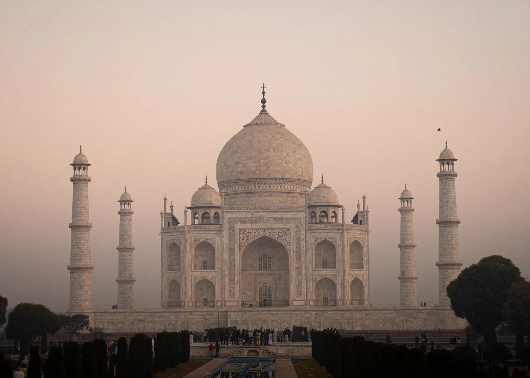 India — The iconic Taj Mahal in Agra, India at sunrise, showcasing its majestic white marble and architectural beauty.