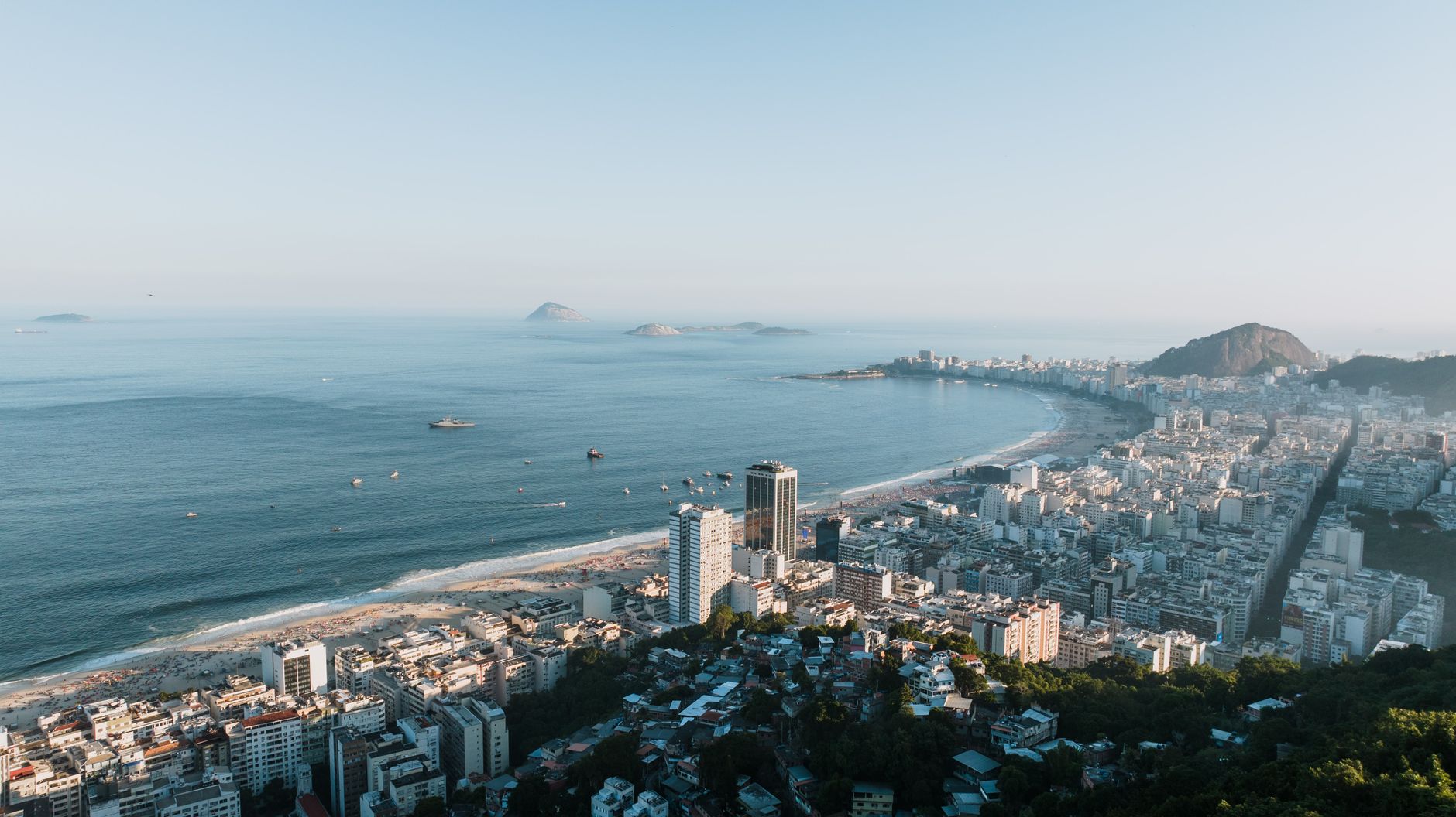 Brazil — Aerial image showcasing Rio de Janeiro's stunning coastline and cityscape, featuring Copacabana Beach.