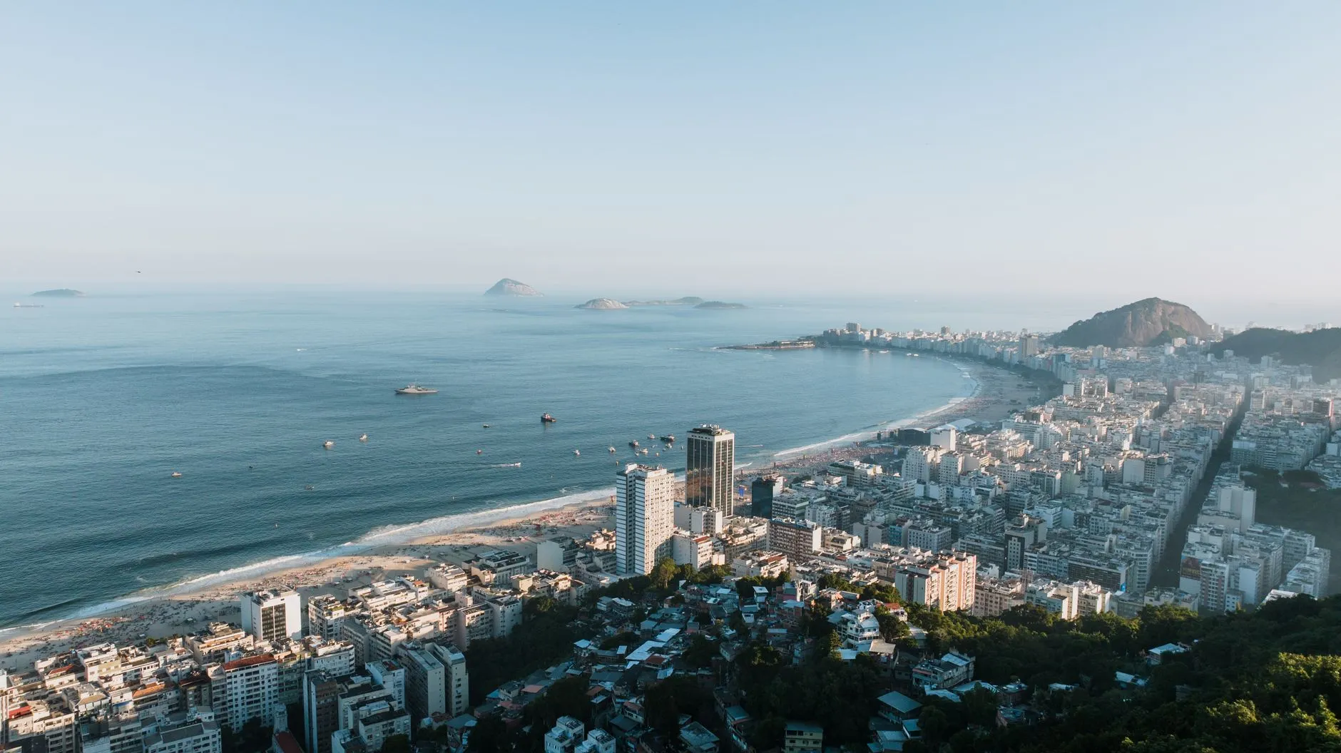 Brazil — Aerial image showcasing Rio de Janeiro's stunning coastline and cityscape, featuring Copacabana Beach.