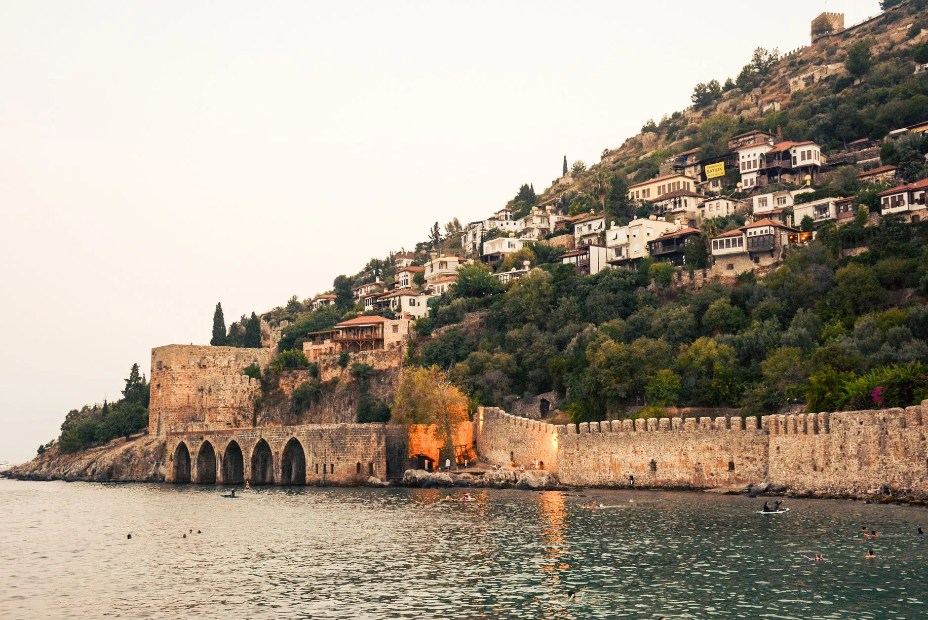 Alanya, Türkiye — Alanya Castle overlooking the serene Mediterranean Sea at sunset, capturing timeless architecture.