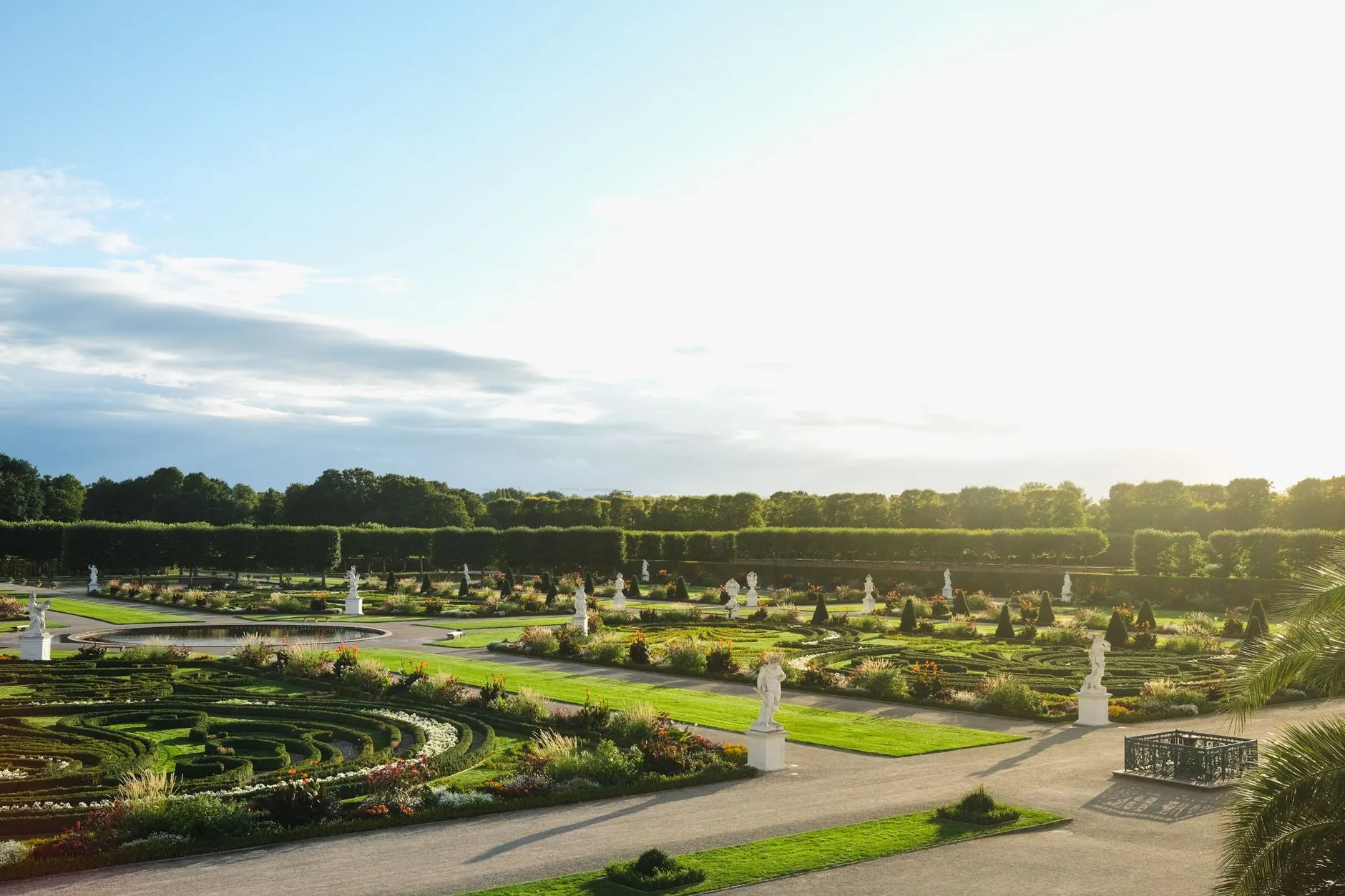 Hannover, Germany — Serene aerial view of Herrenhausen Gardens with vibrant greenery and clear sky in Hannover, Germany.