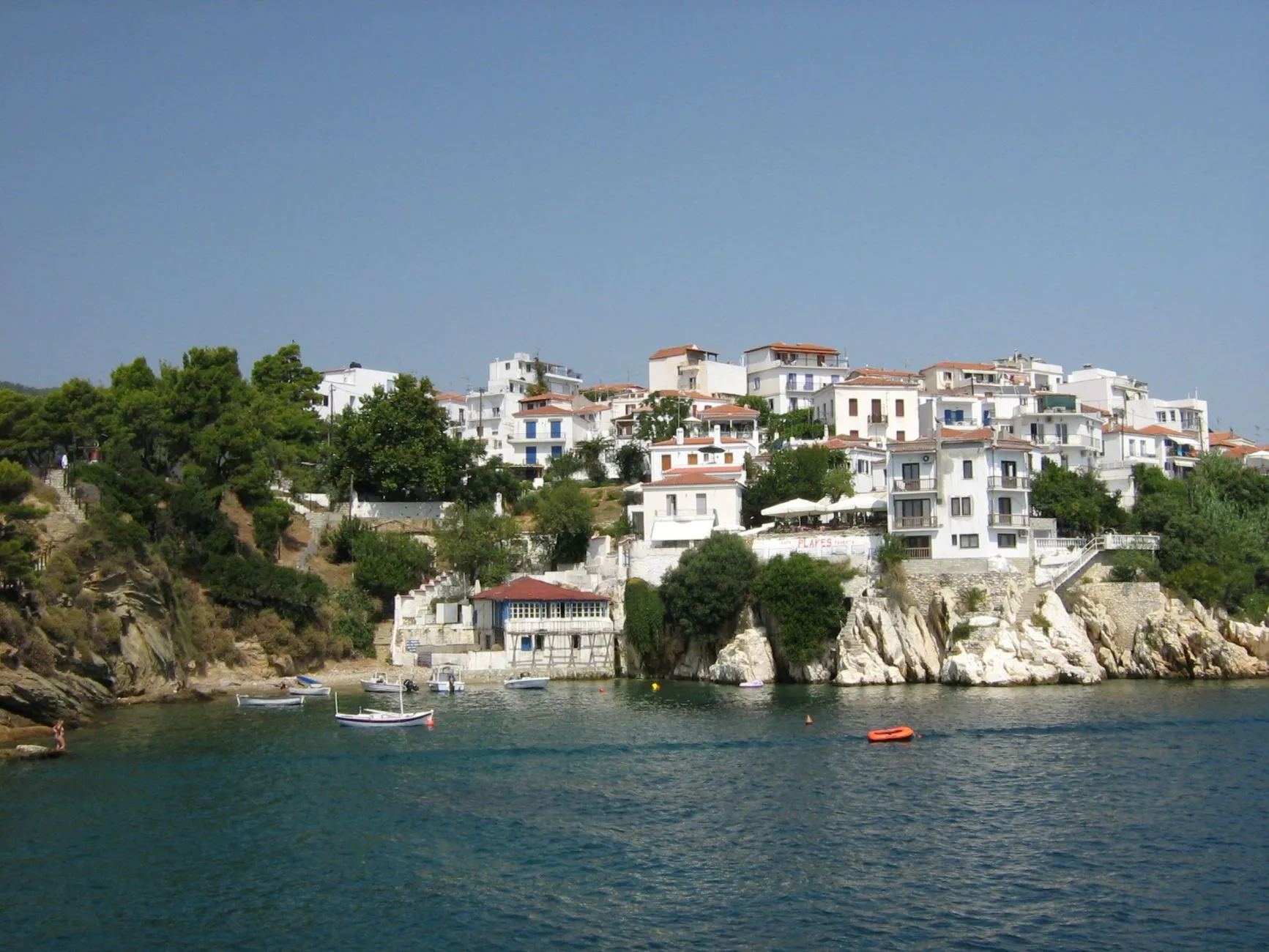 Skiathos, Greece — Discover the picturesque traditional architecture of Skiathos, Greece, by the beautiful Aegean Sea.
