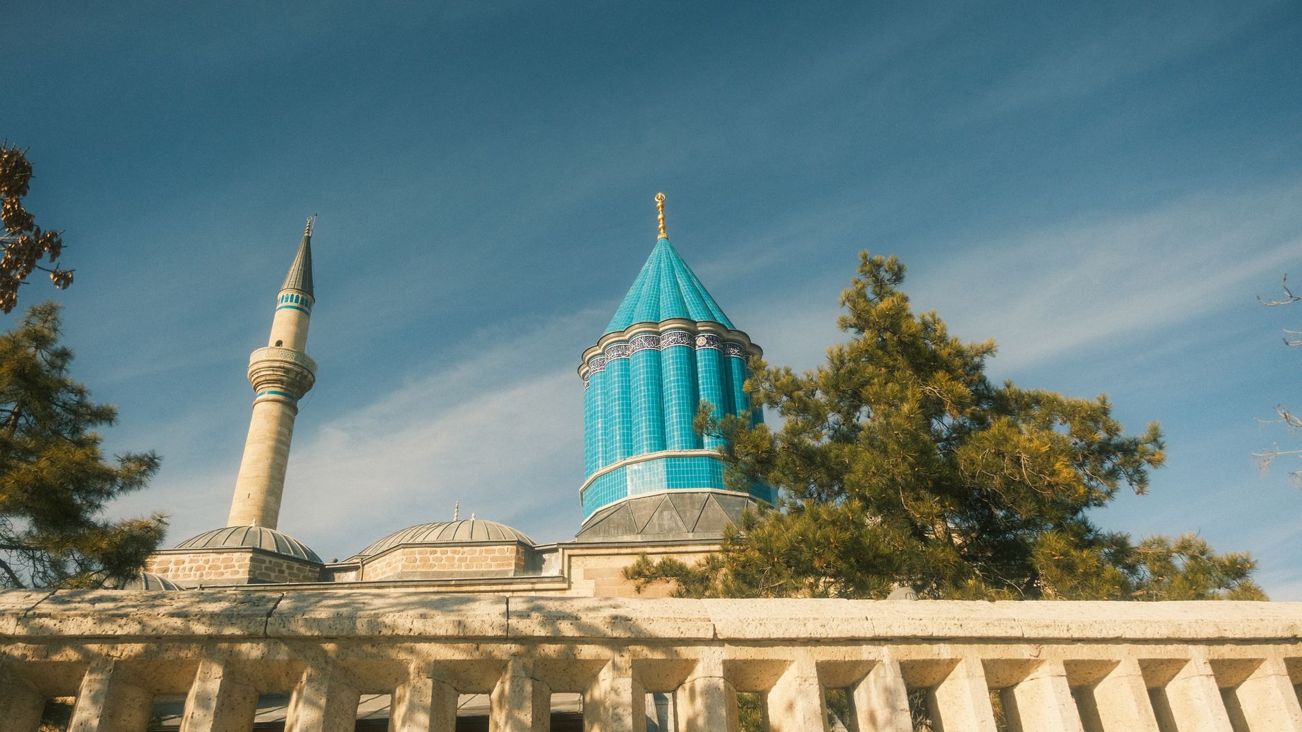 Konya, Türkiye — Blue dome of Mevlana Museum with minaret in Konya, Turkey, under clear skies.