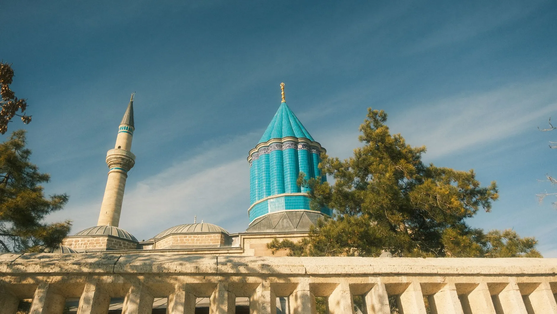 Konya, Türkiye — Blue dome of Mevlana Museum with minaret in Konya, Turkey, under clear skies.