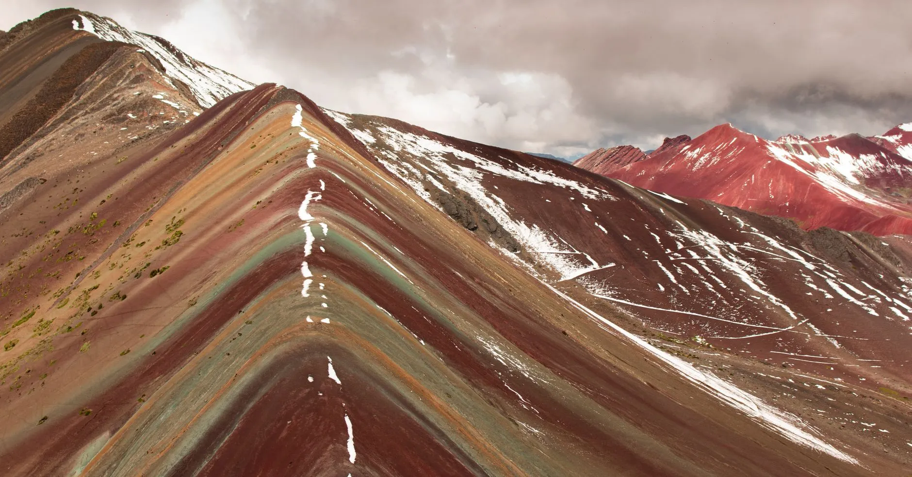 Peru — Stunning view of the vibrant Rainbow Mountain in Cusco, Peru, showcasing its vibrant colors and unique geological formations.