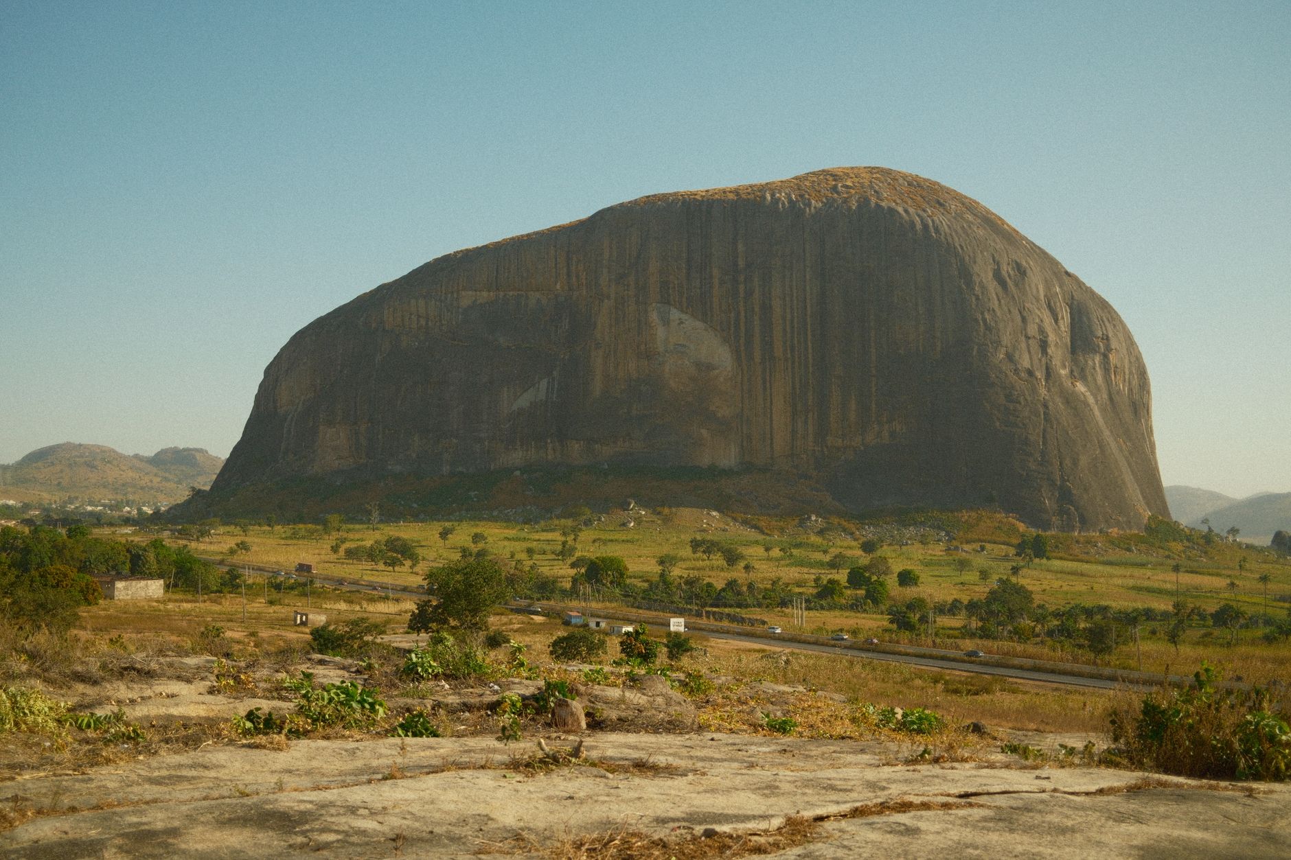 Nigeria — Iconic Zuma Rock with its stunning natural beauty in Abuja, Nigeria, stands majestically under the clear sky.